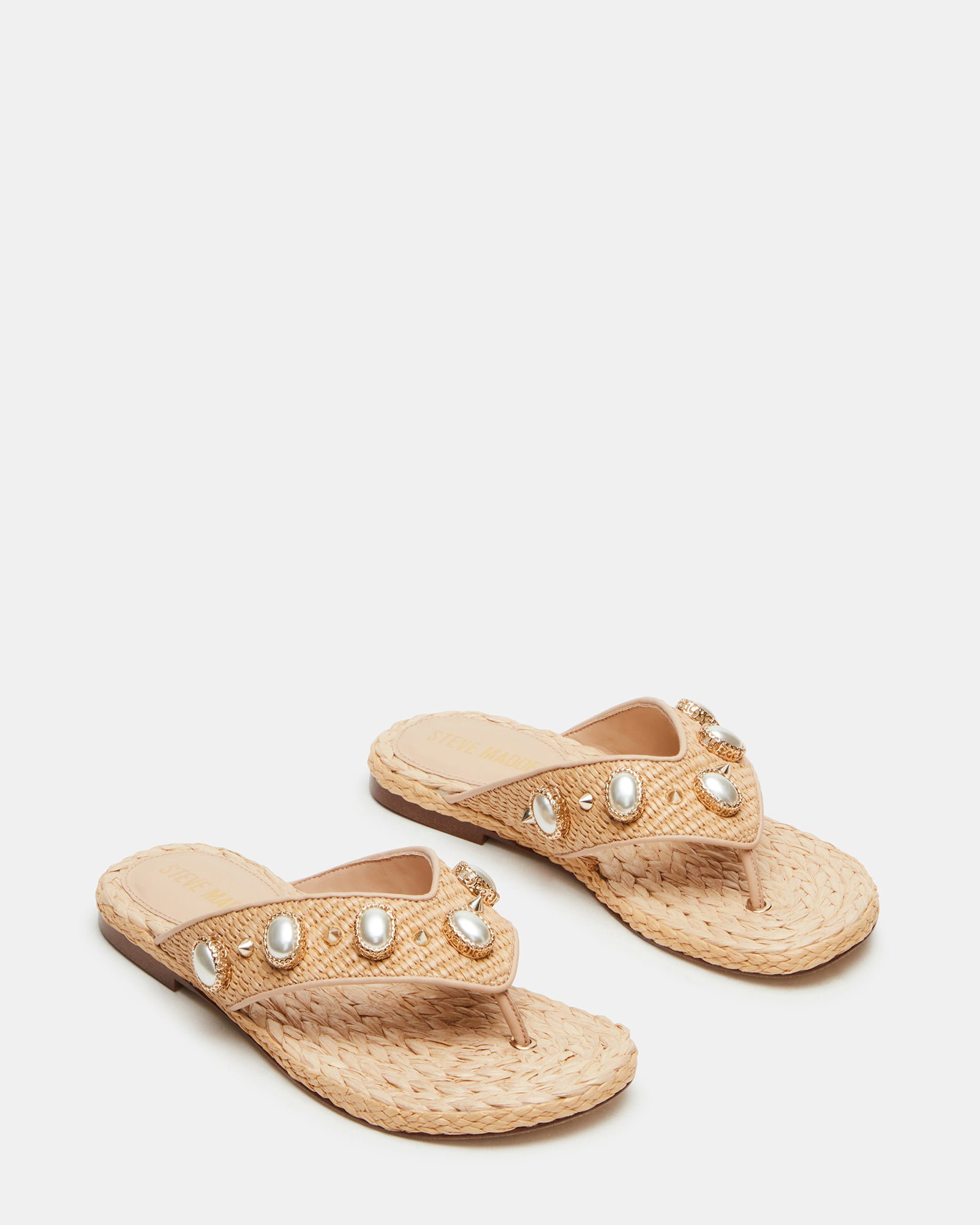 Side profile showing the wedge silhouette of raffia platform sandals