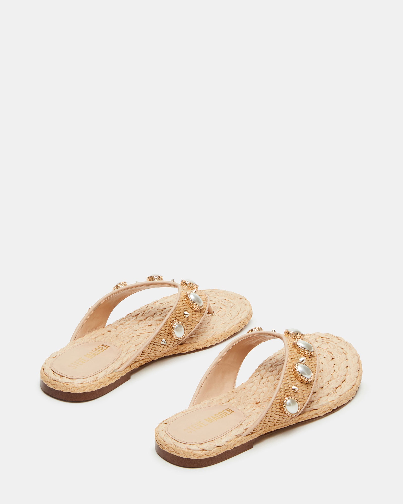Side profile showing the wedge silhouette of raffia platform sandals