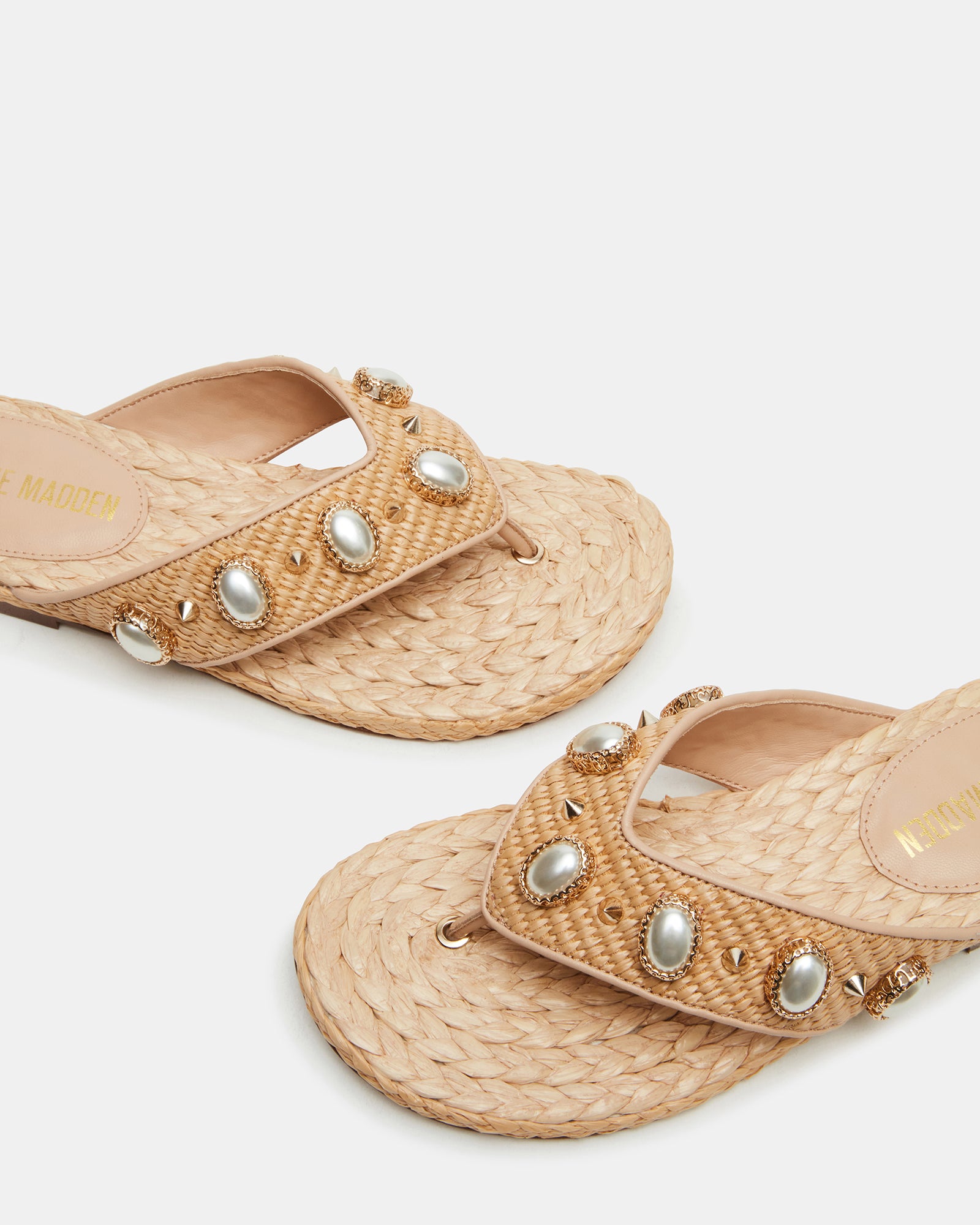 Pair of sandals styled with linen pants for summer outfits