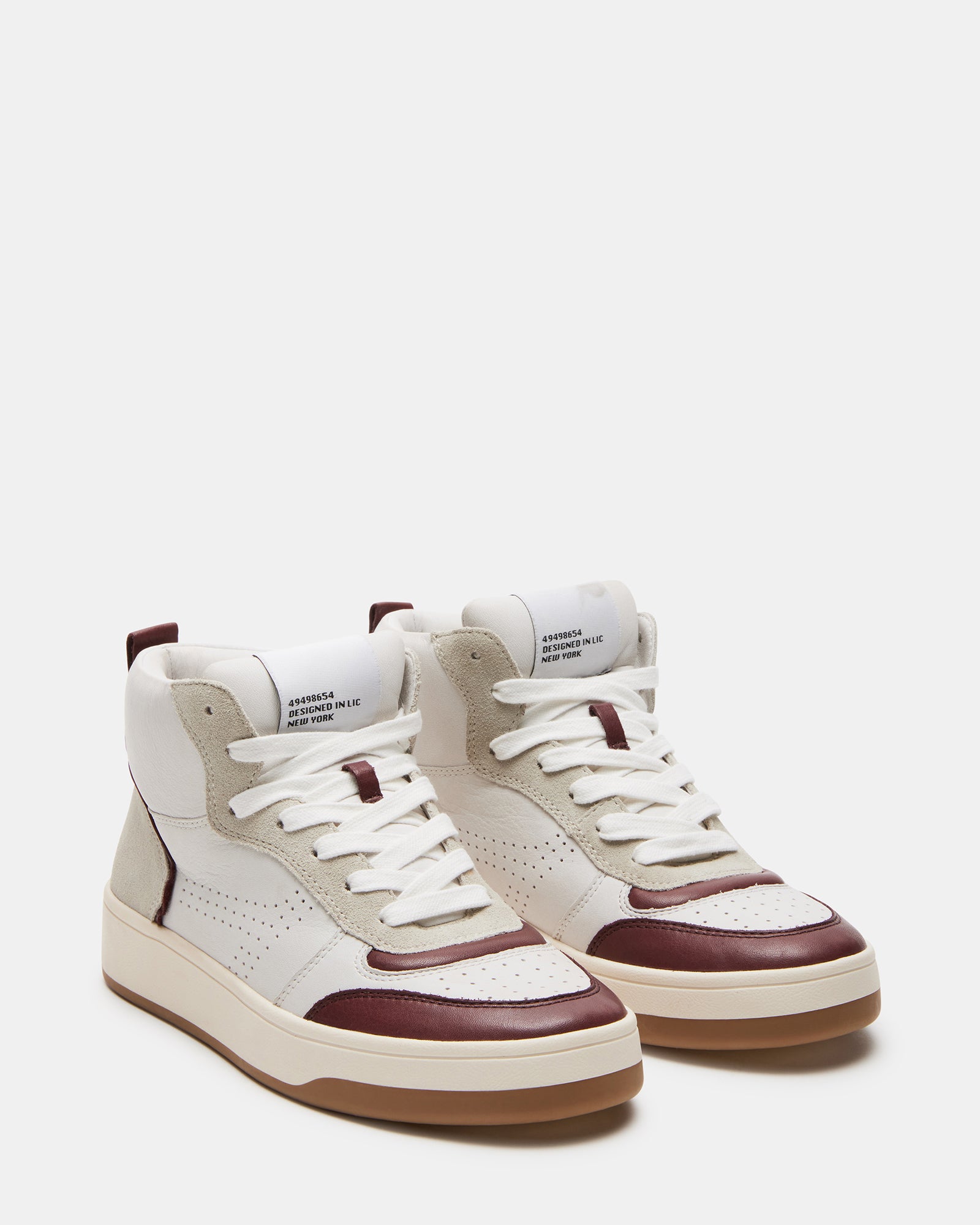 Close-up of flatform sneakers showing contrast paneling and padded collar.