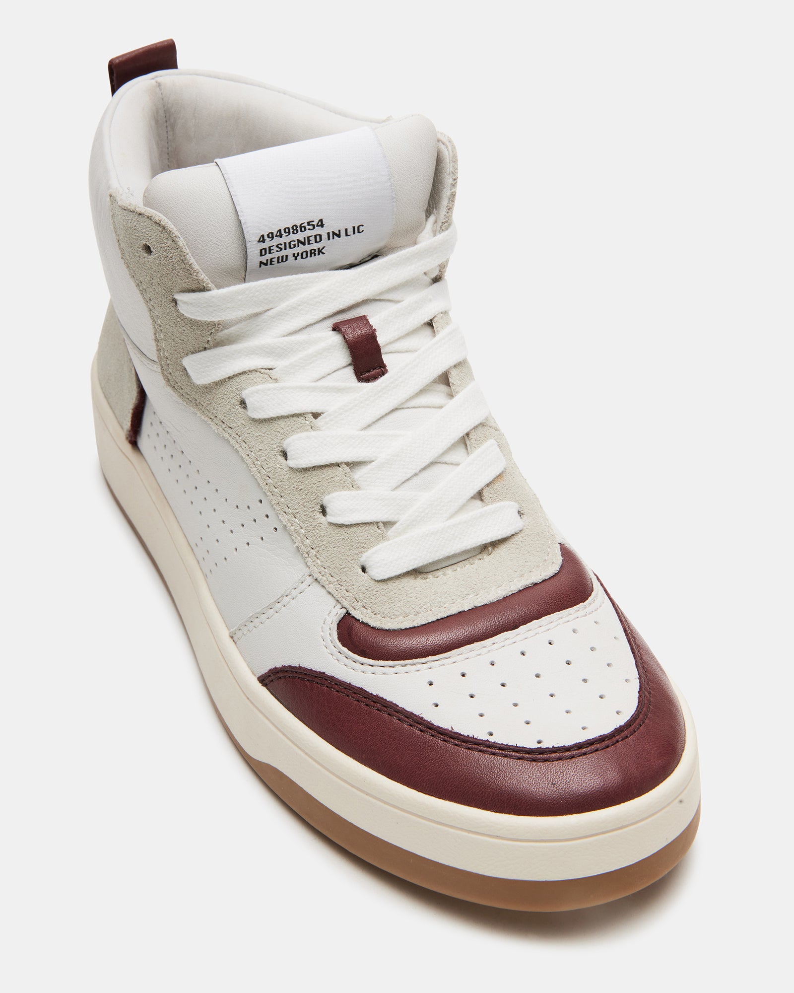 Side view of womens black sneakers styled for casual Chicago streetwear.