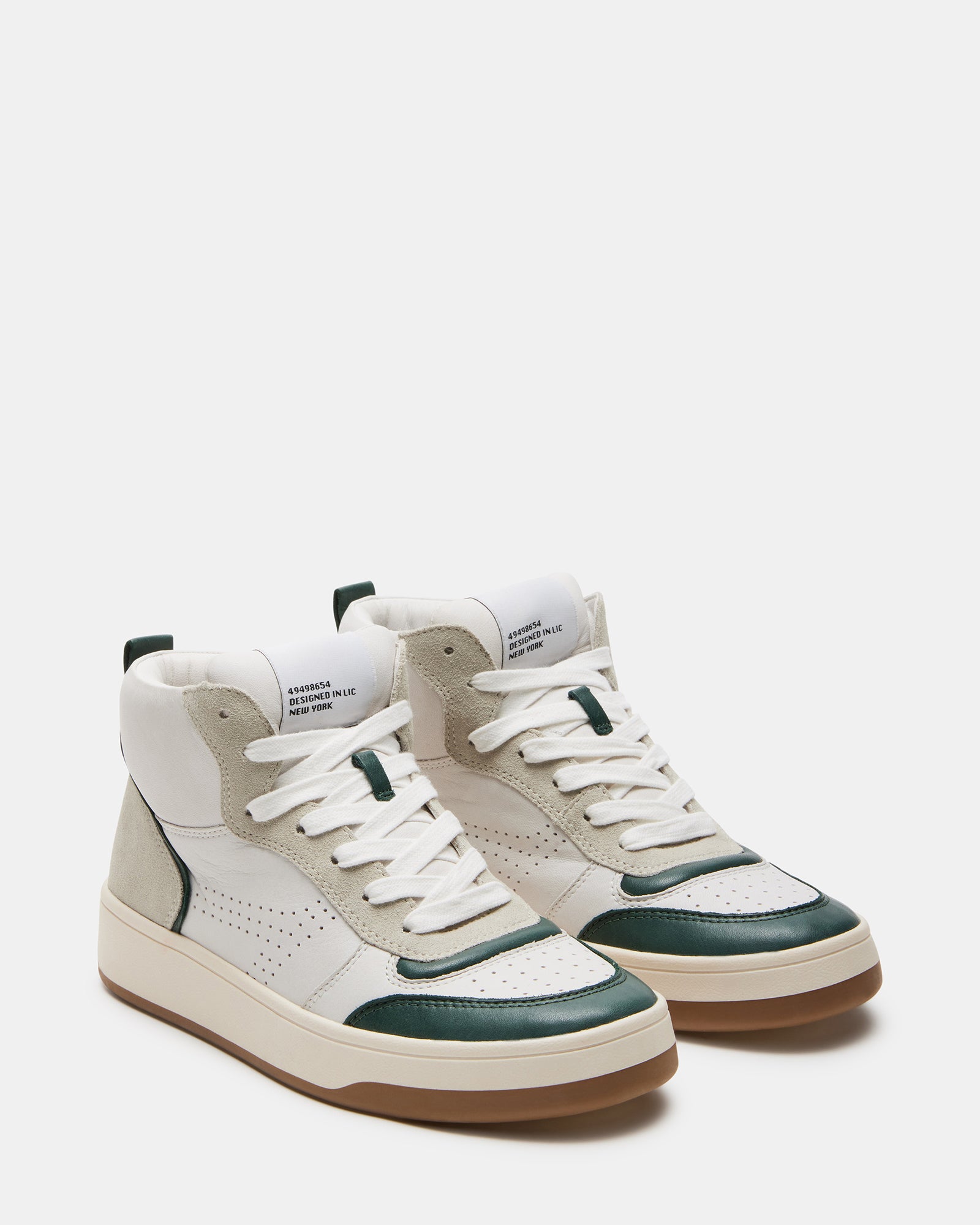 Close-up of padded ankle collar and contrast outsole on green leather sneakers