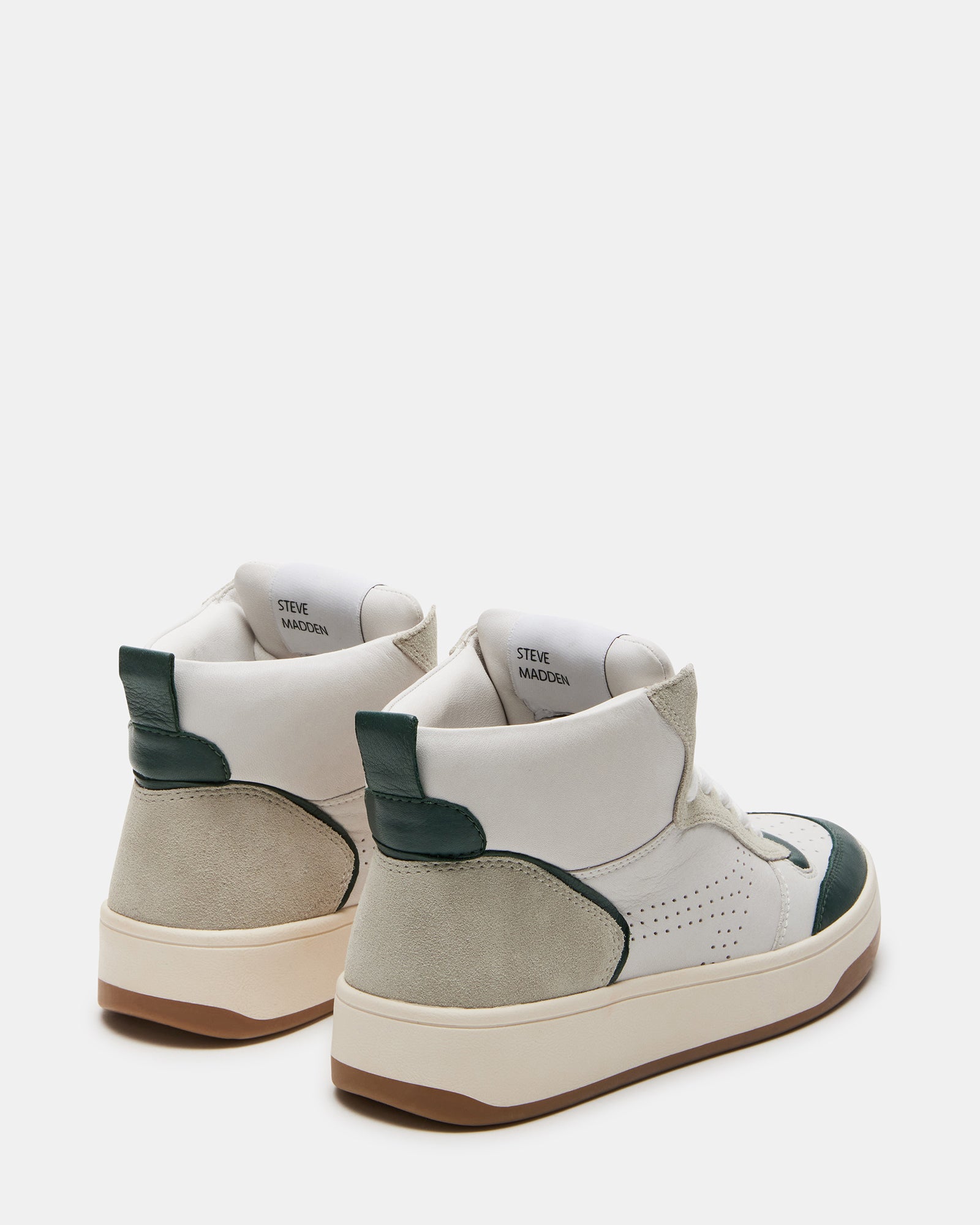 Close-up of padded ankle collar and contrast outsole on green leather sneakers