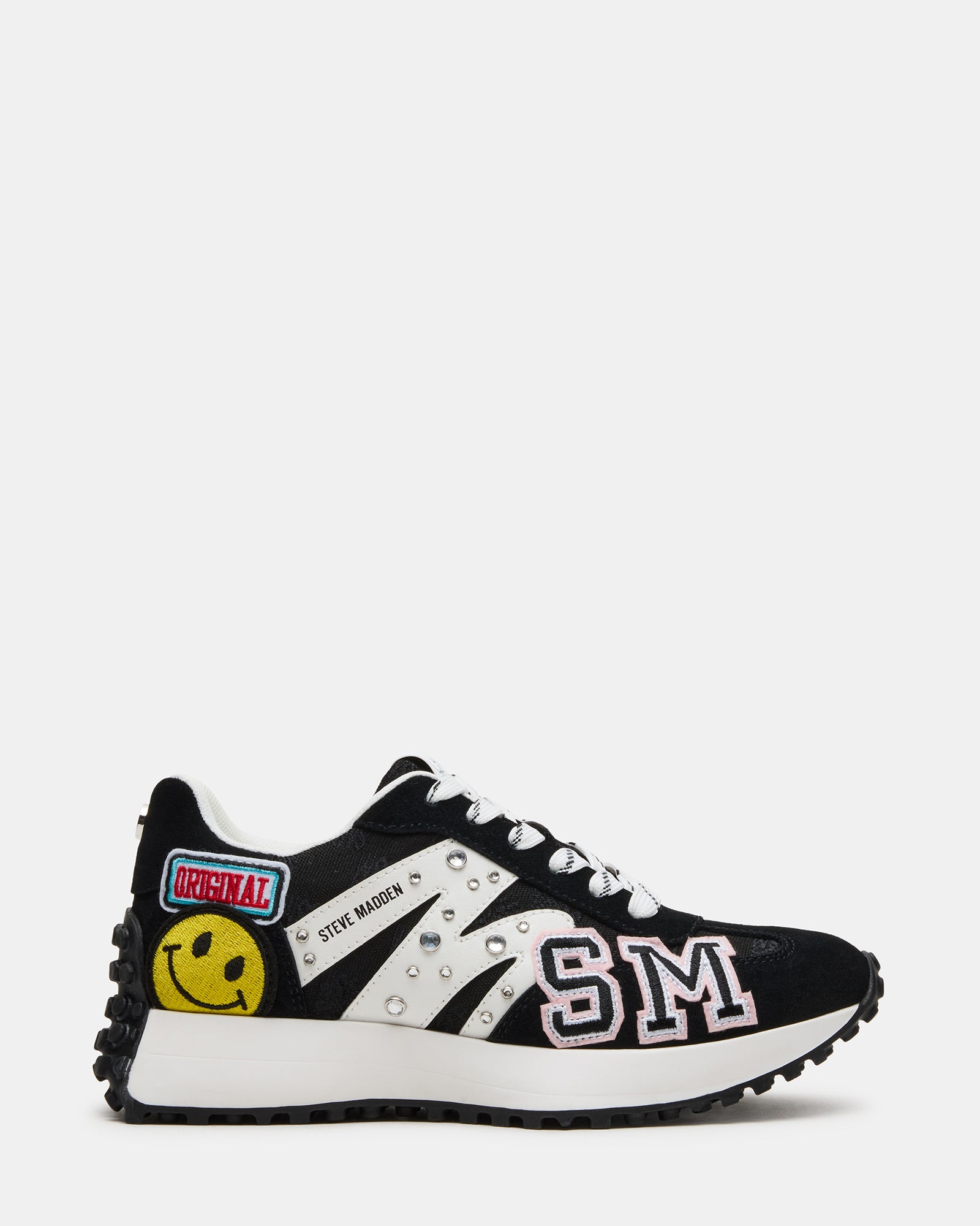 Front angle of black and white sneakers showing the textured heel detail