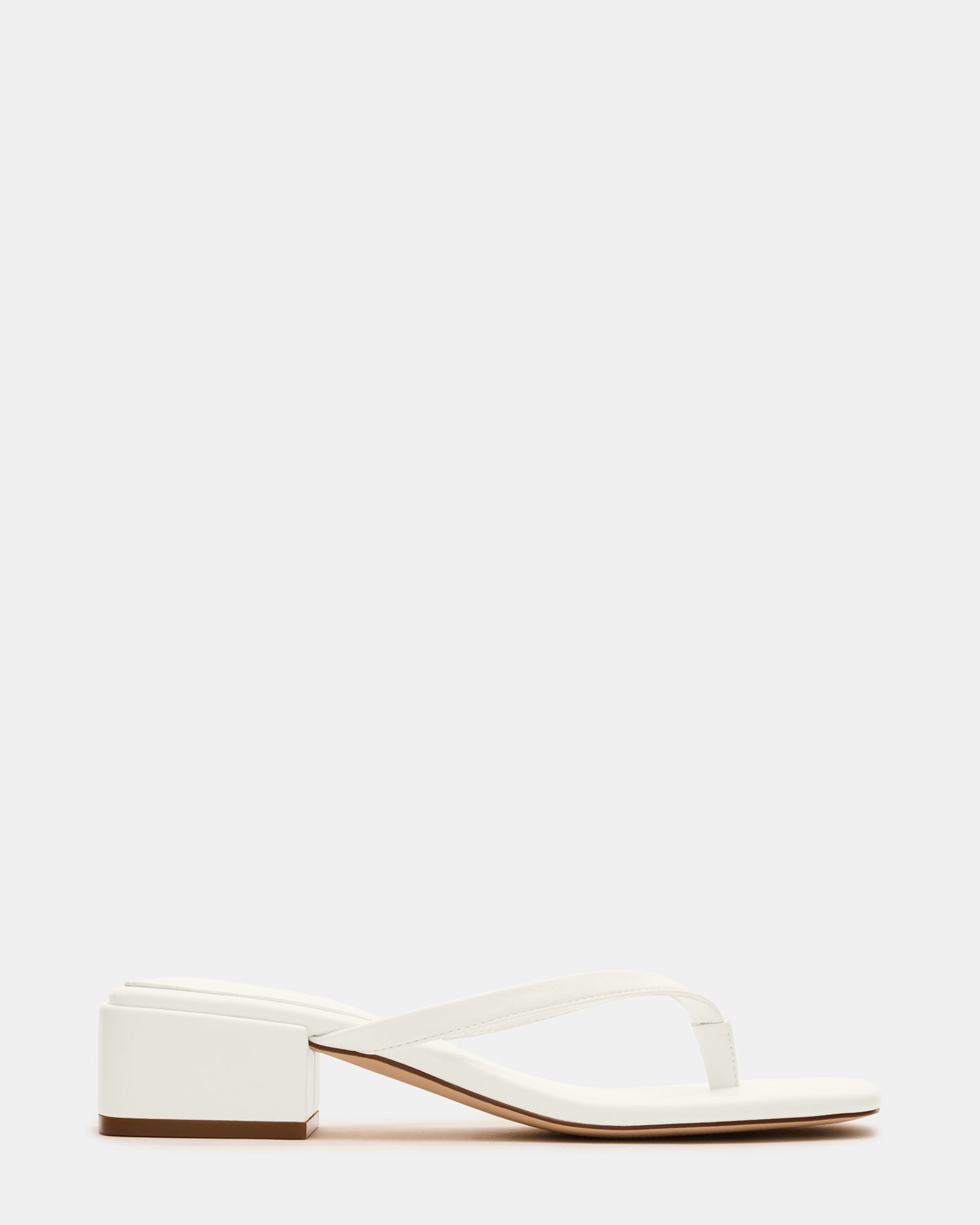 Caribbean Chic square toe mule sandals at the beach, showcasing comfort and style.
