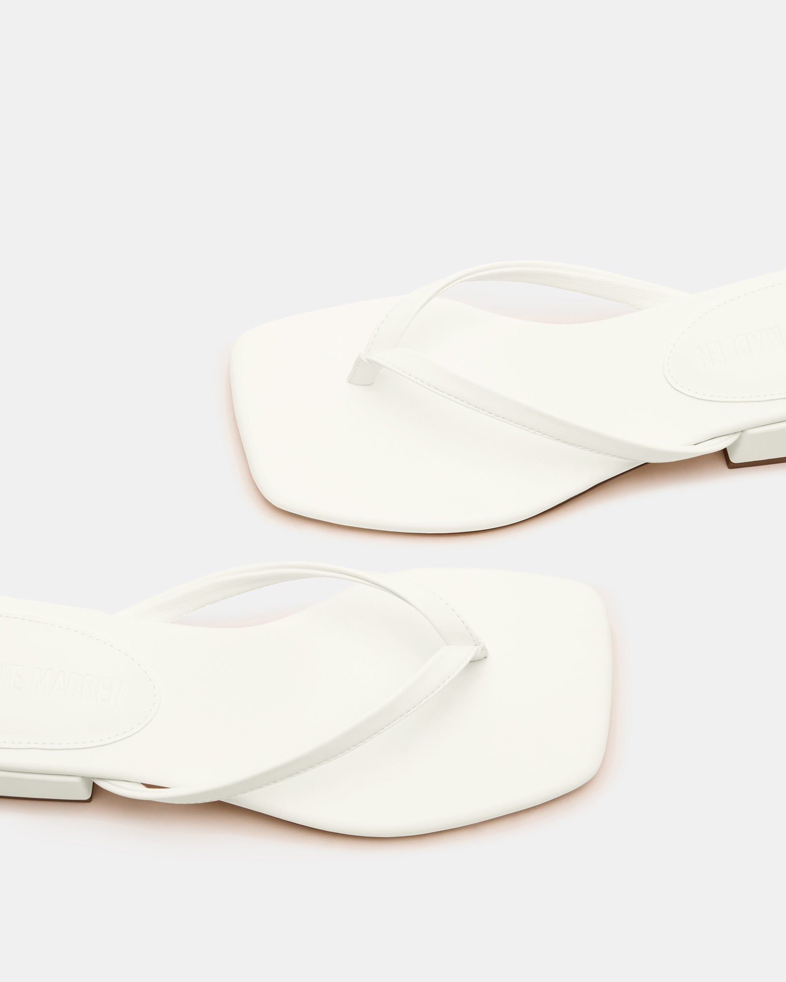 Caribbean Chic square toe mule sandals at the beach, showcasing comfort and style.