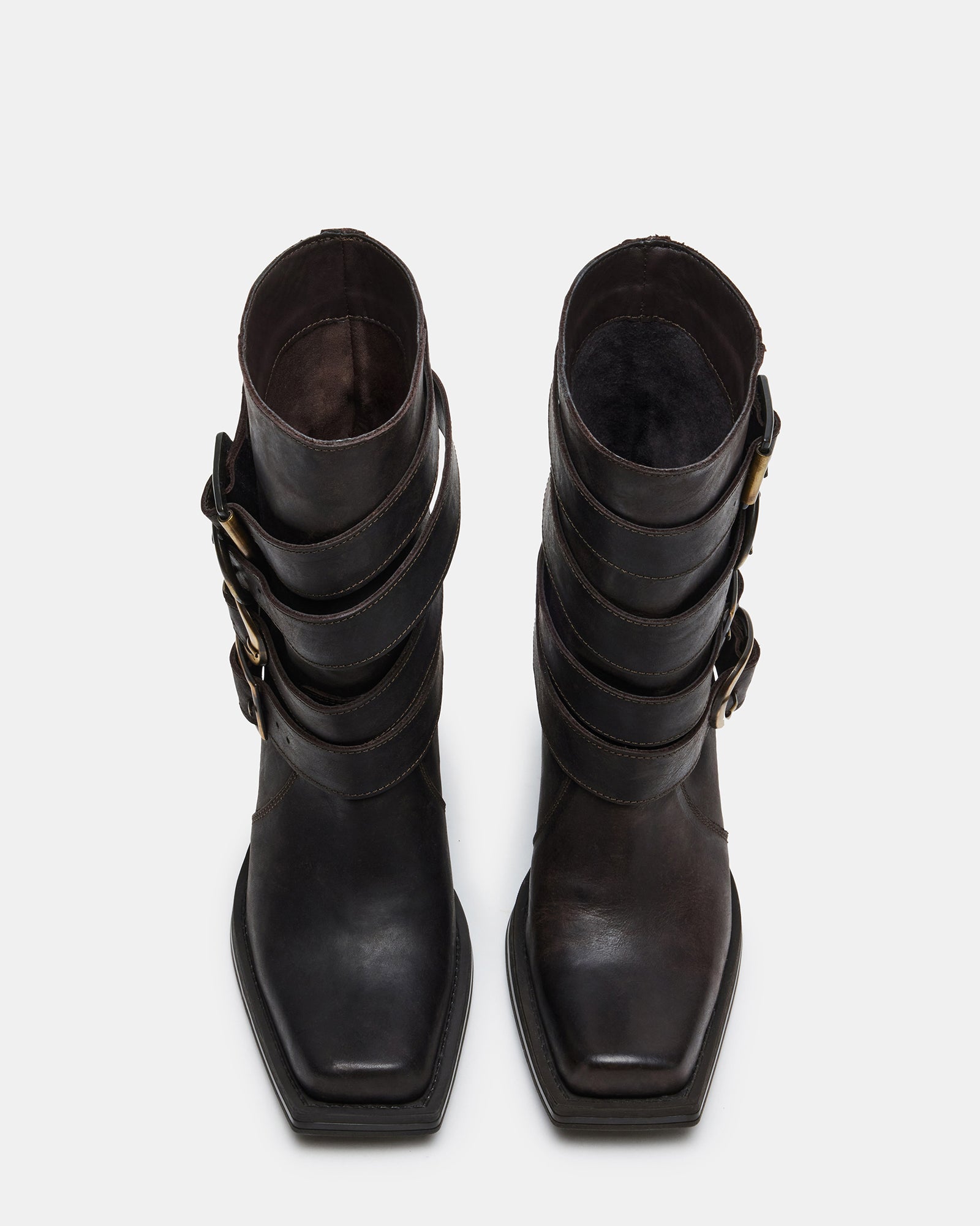 Close-up of distressed detailing on womens brown leather boots