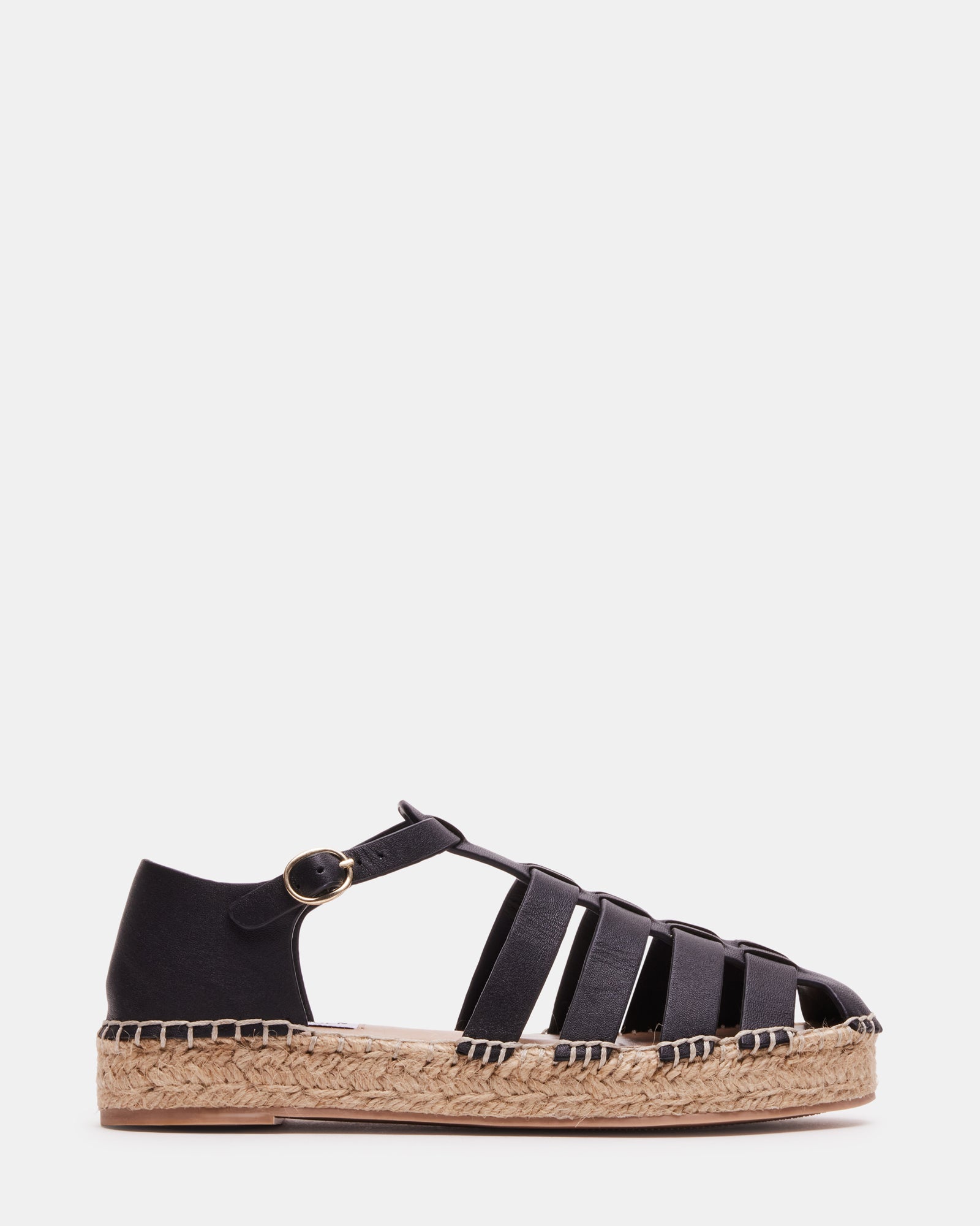 Top view of black flat shoes styled on a minimalist background