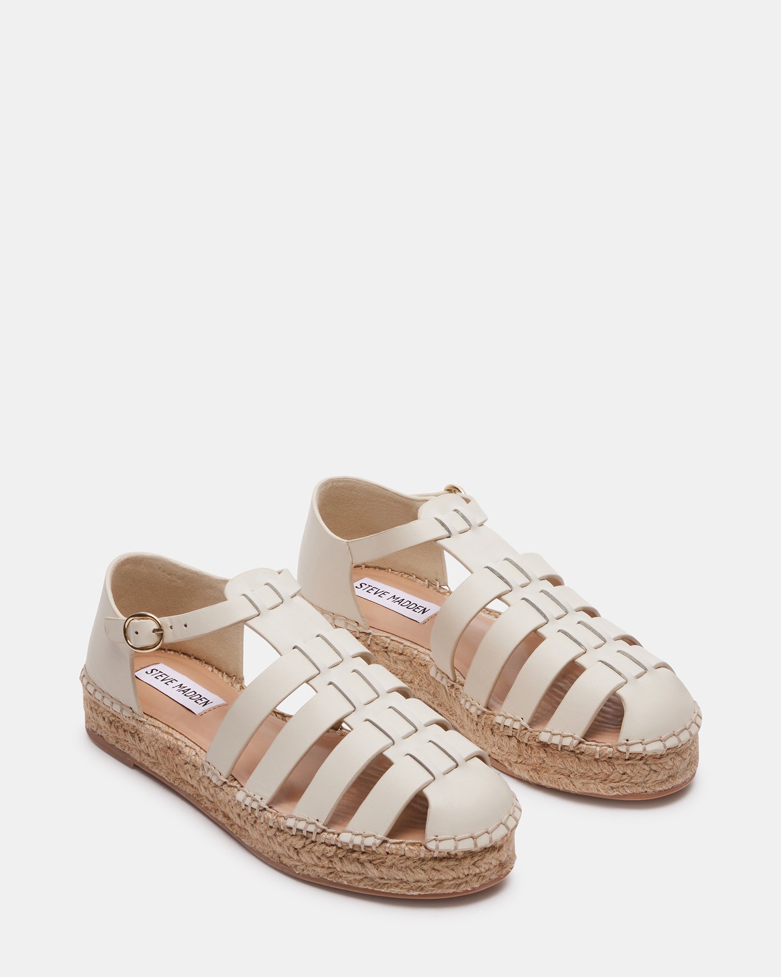 Close-up of the leather upper and flat sole of espadrilles for women