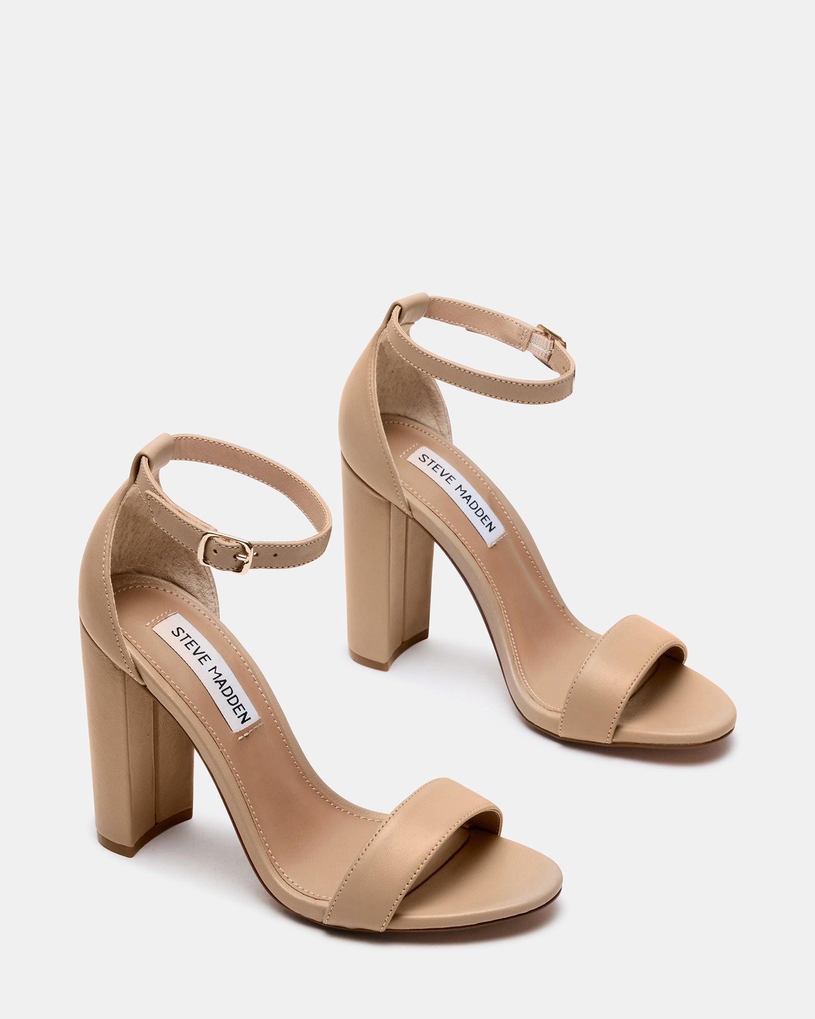 Carrson blush leather block heel sandals styled with skinny jeans for a chic, casual look.