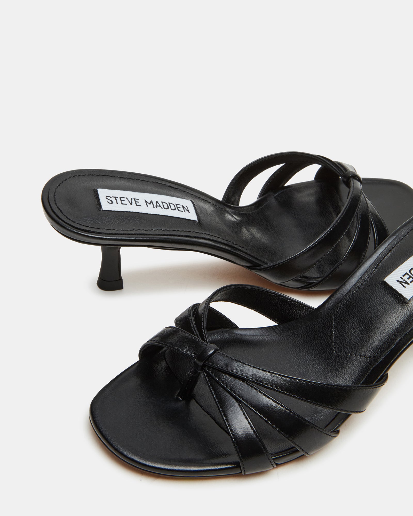 Side view of black mules heels with square toe and 2.75-inch heel