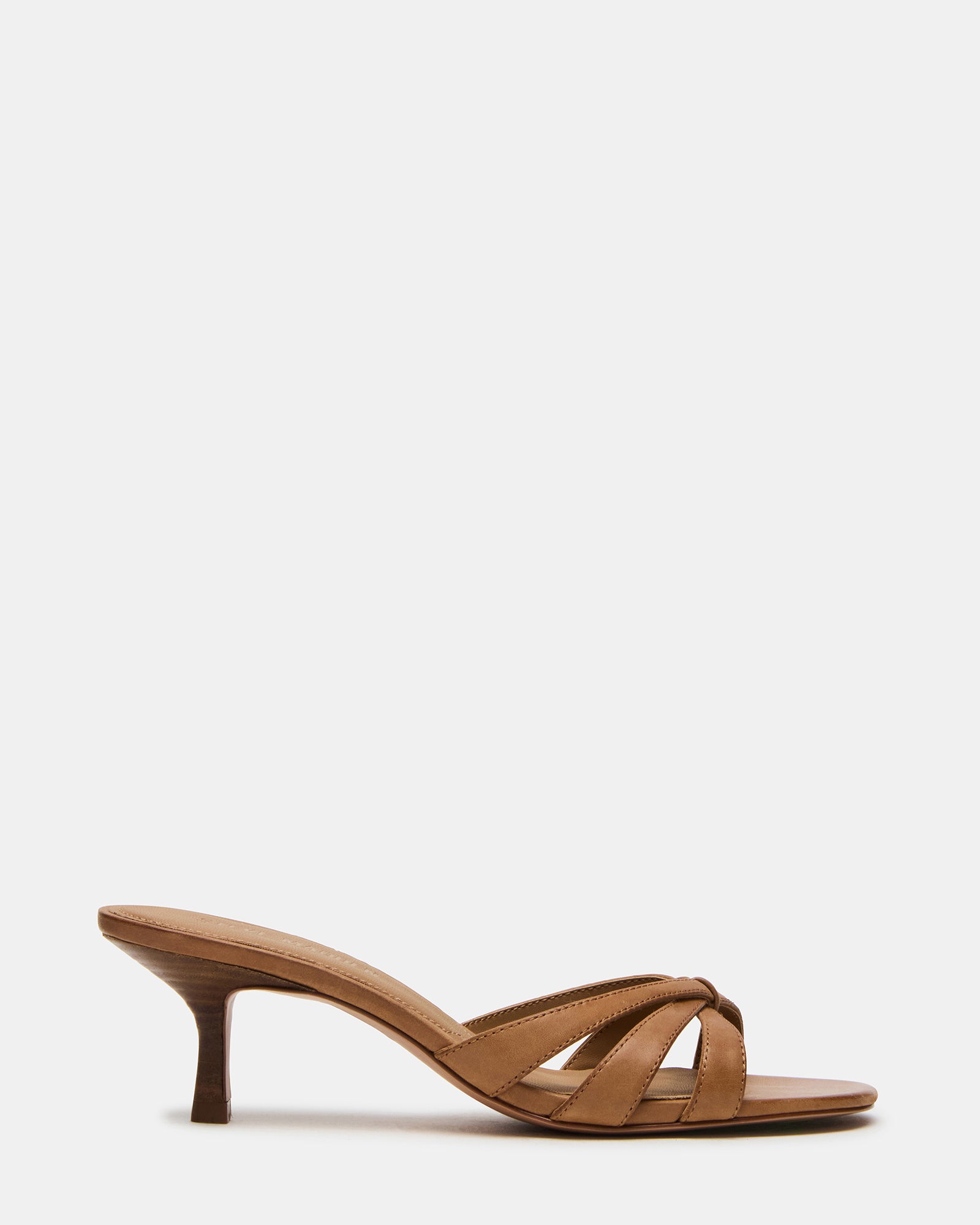 Cary camel leather mules worn with a sundress, showcasing the open toe design.