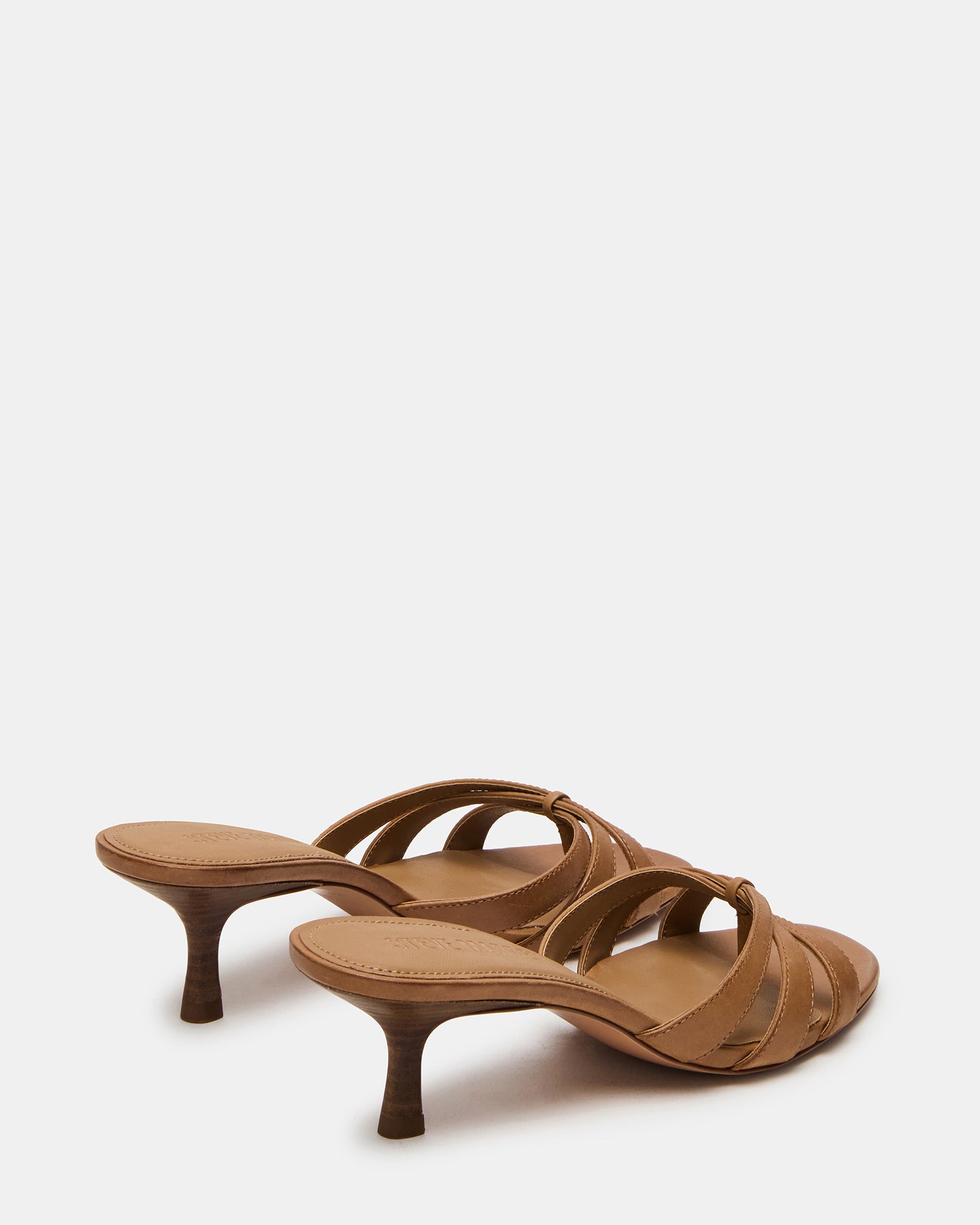 Side view of the black leather mules highlighting the 2.75-inch heel.