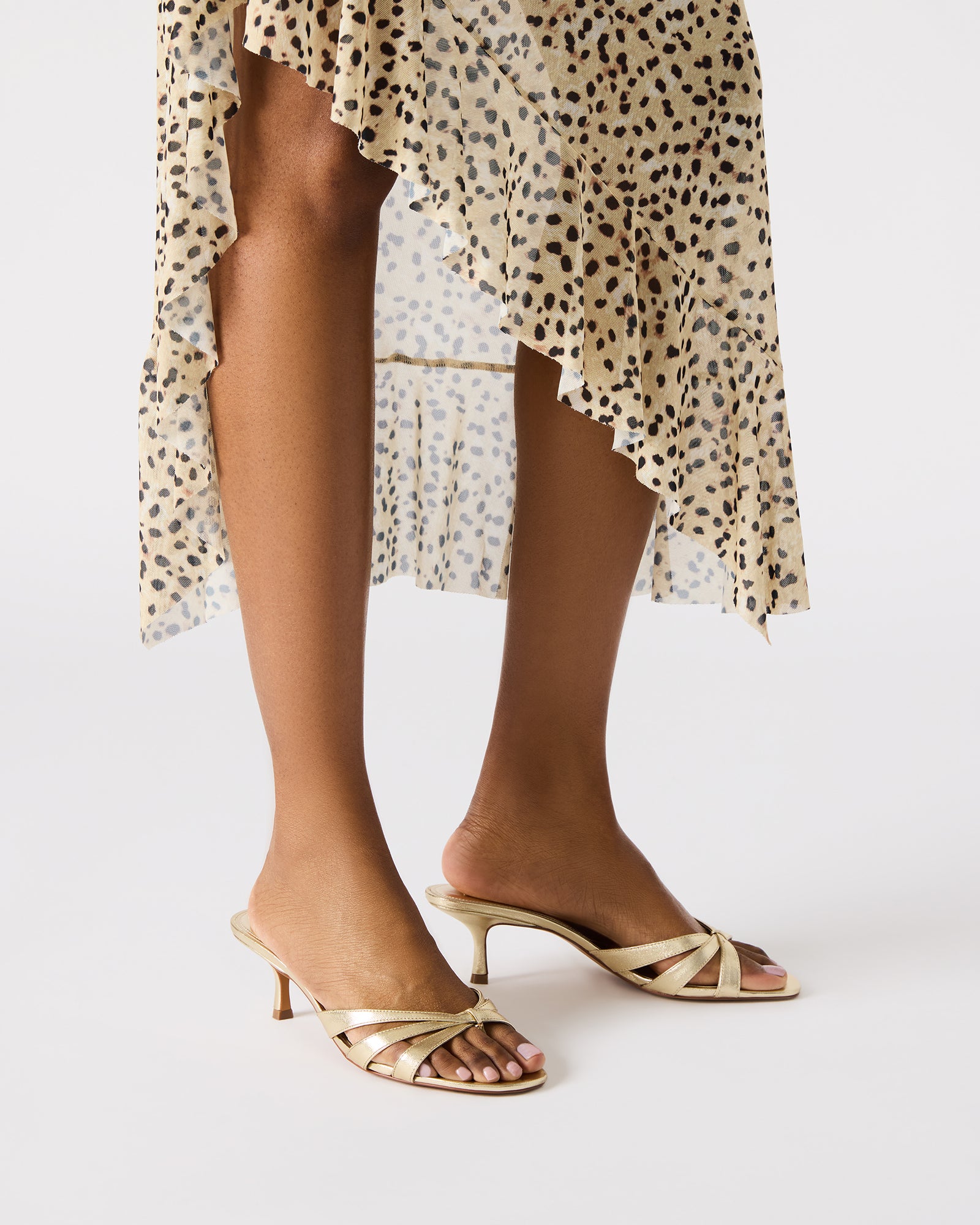 Side view of Cary Gold Leather mules highlighting the stylish design and premium leather material