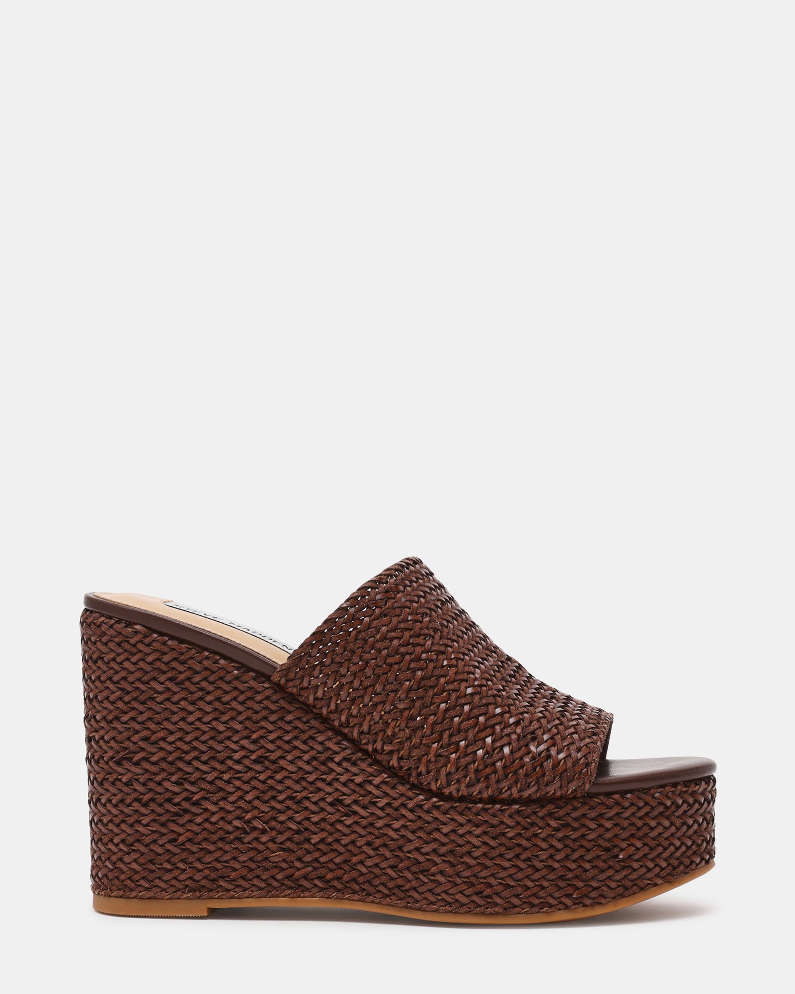 Cassi Brown wedge sandals showcasing the raffia upper from the side angle.