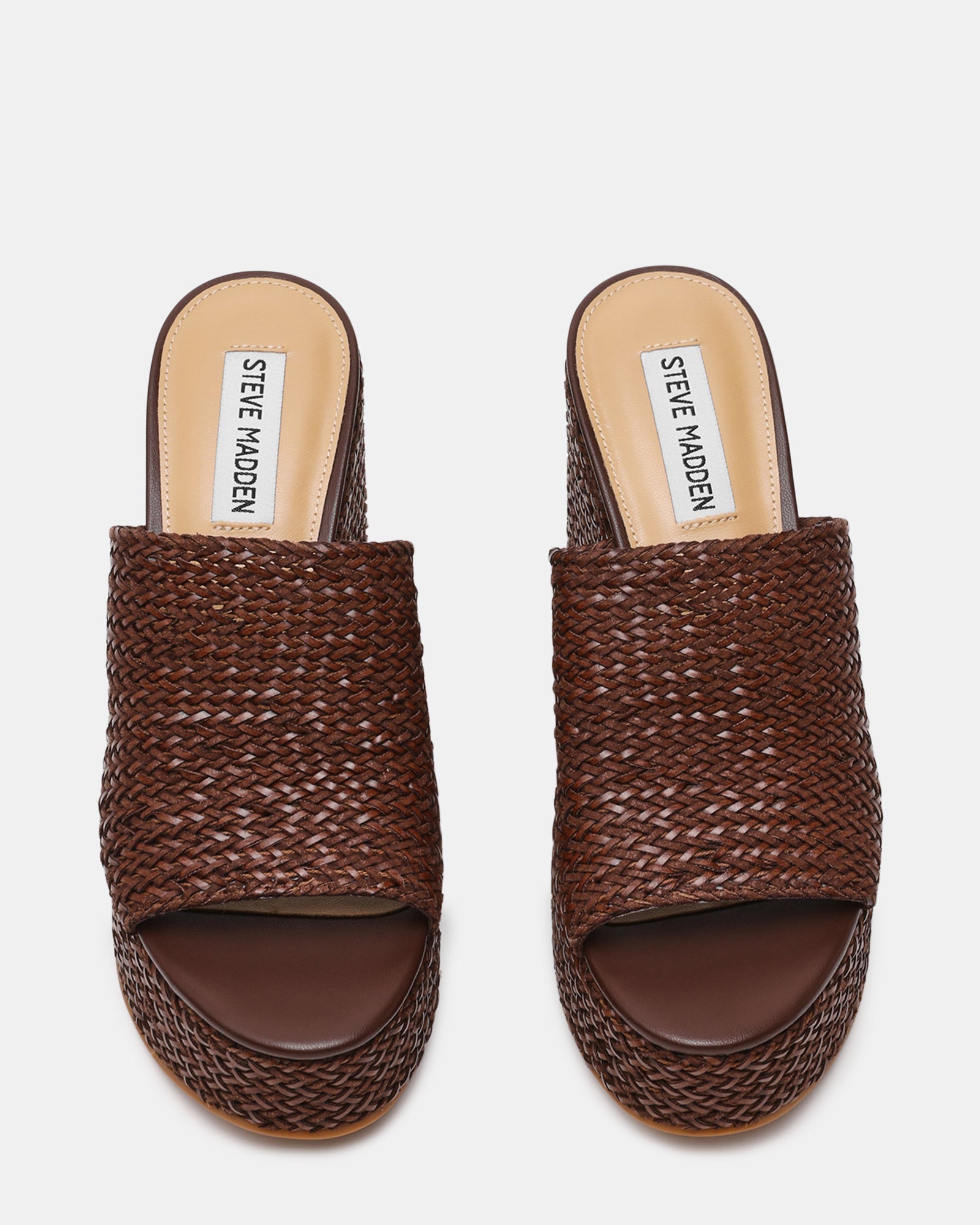 Cassi Brown wedge sandals showcasing the raffia upper from the side angle.