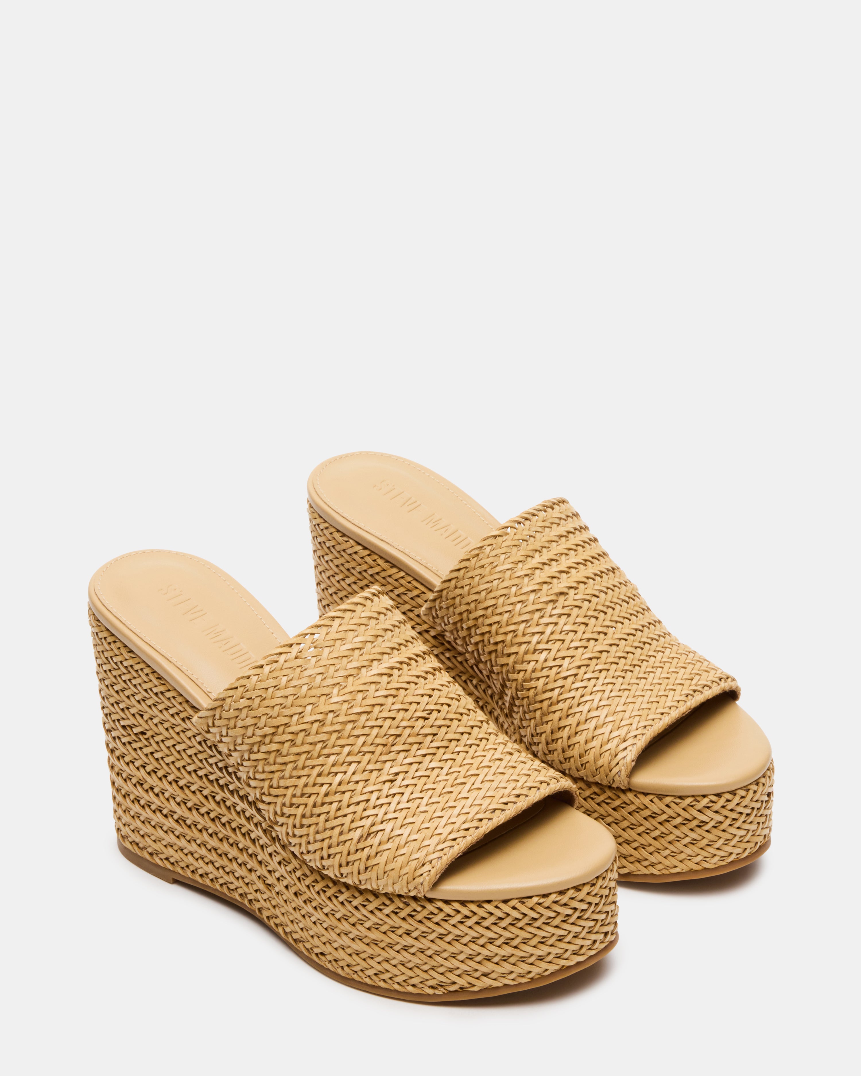 Close-up of platform shoes black heels with textured sole and synthetic sock