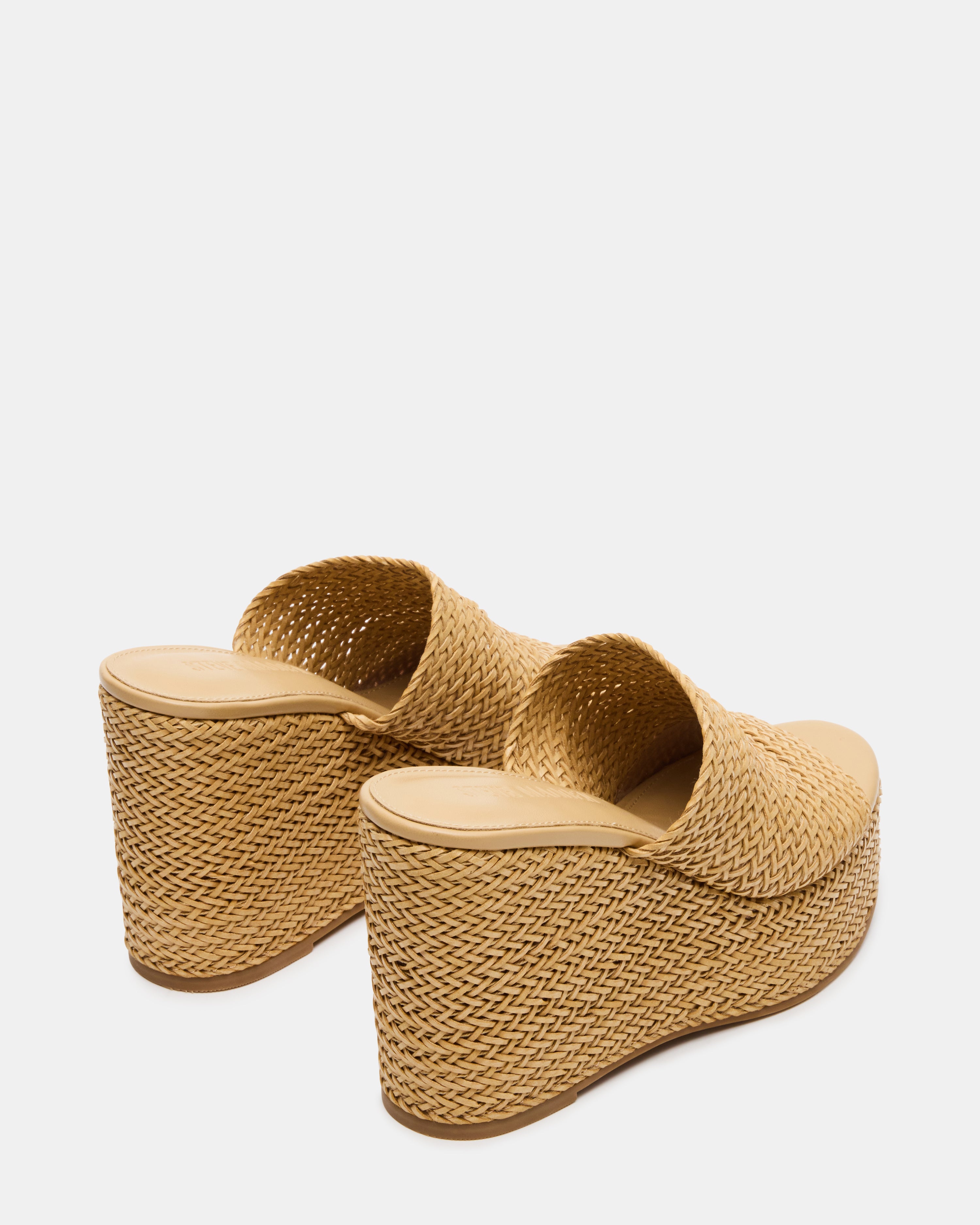 Close-up of platform shoes black heels with textured sole and synthetic sock