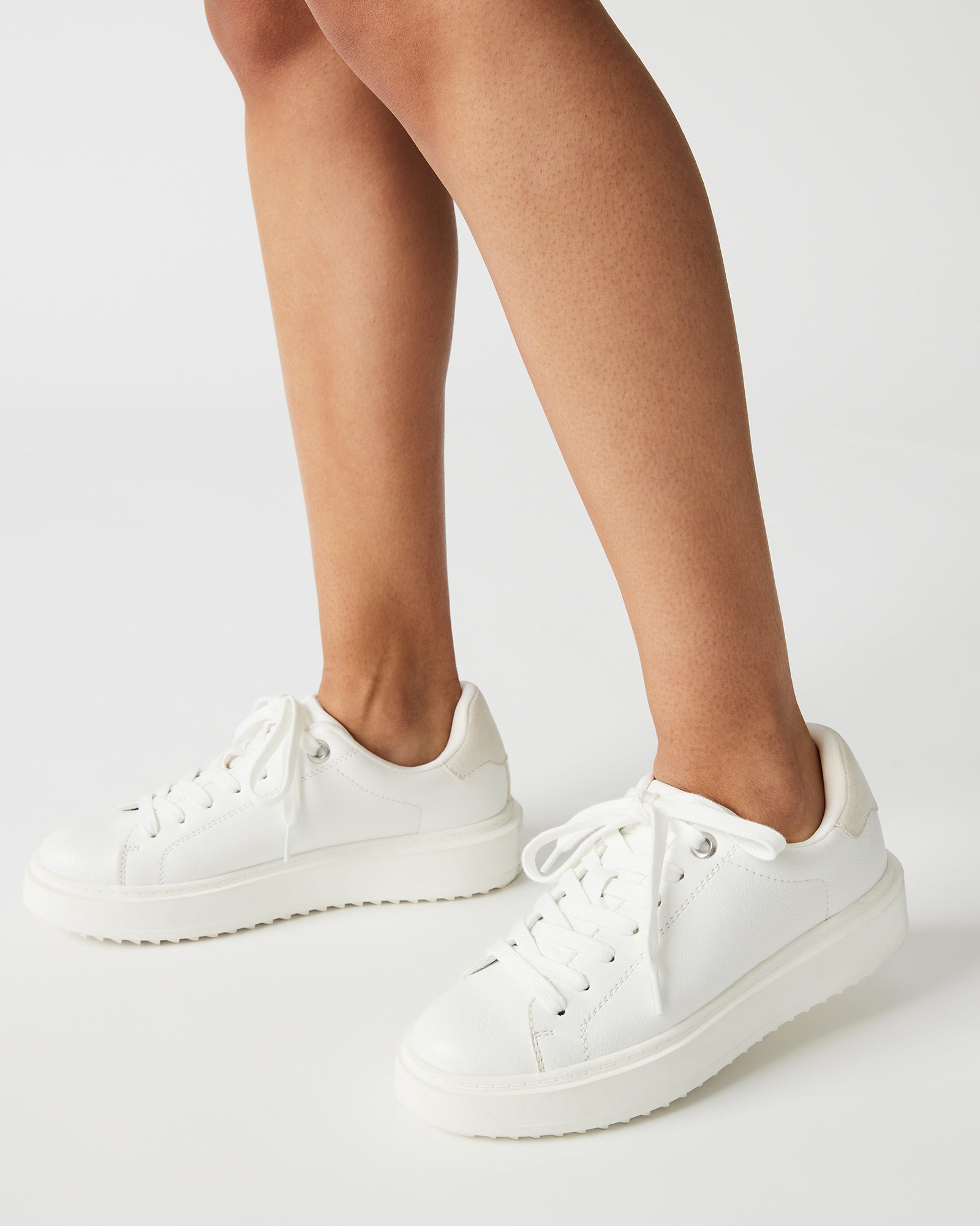 Catcher White Suede Sneakers on a model, perfect for casual outings.