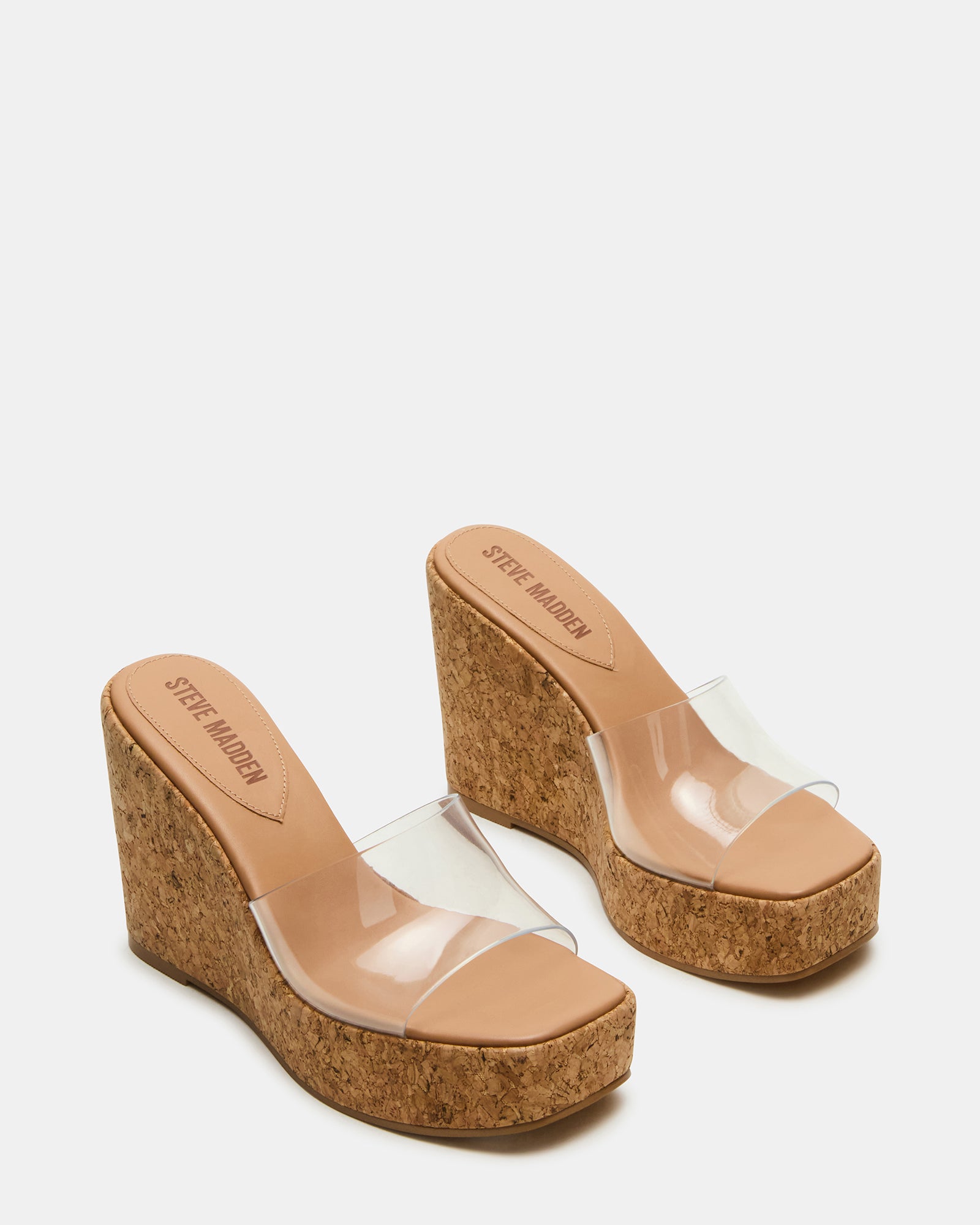 Fashionable white wedge sandals styled with summer dress