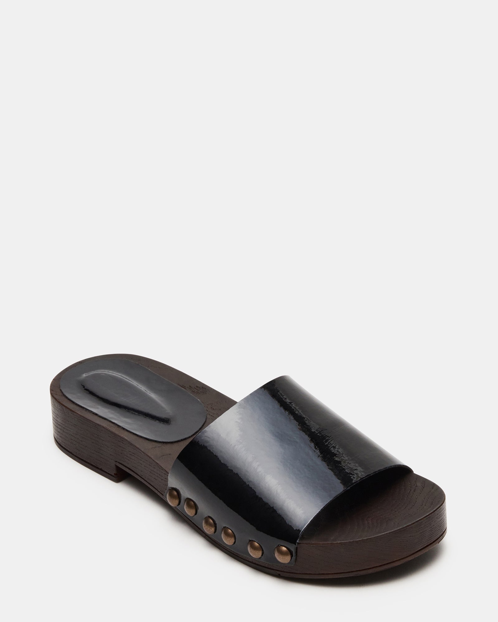 Close-up of studs on womens slide sandals with synthetic upper