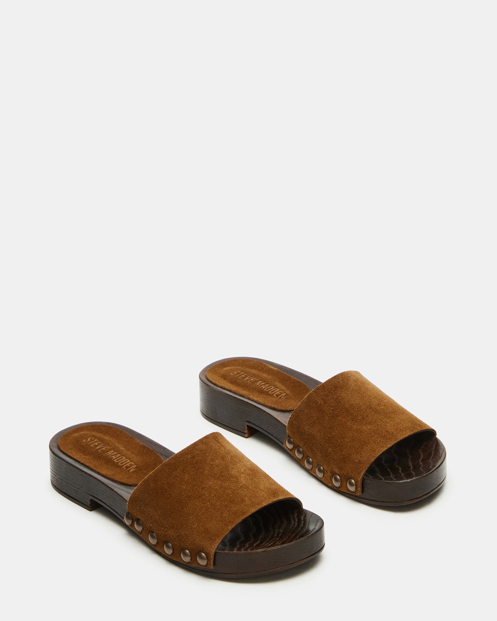Close-up of the Cento slide sandals highlighting the soft suede material and chic studs.