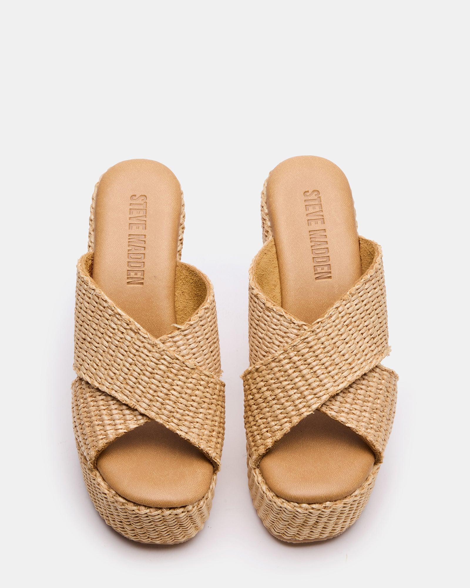 Side view of Cercei wedge shoes showing the raffia texture and heel height