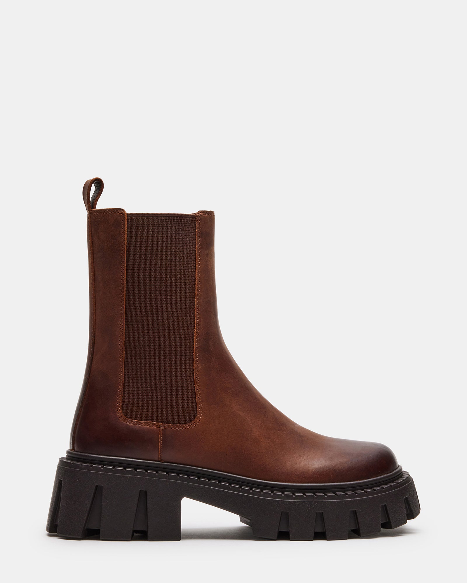 Distressed brown leather Chelsea boots with rugged sole, angled view
