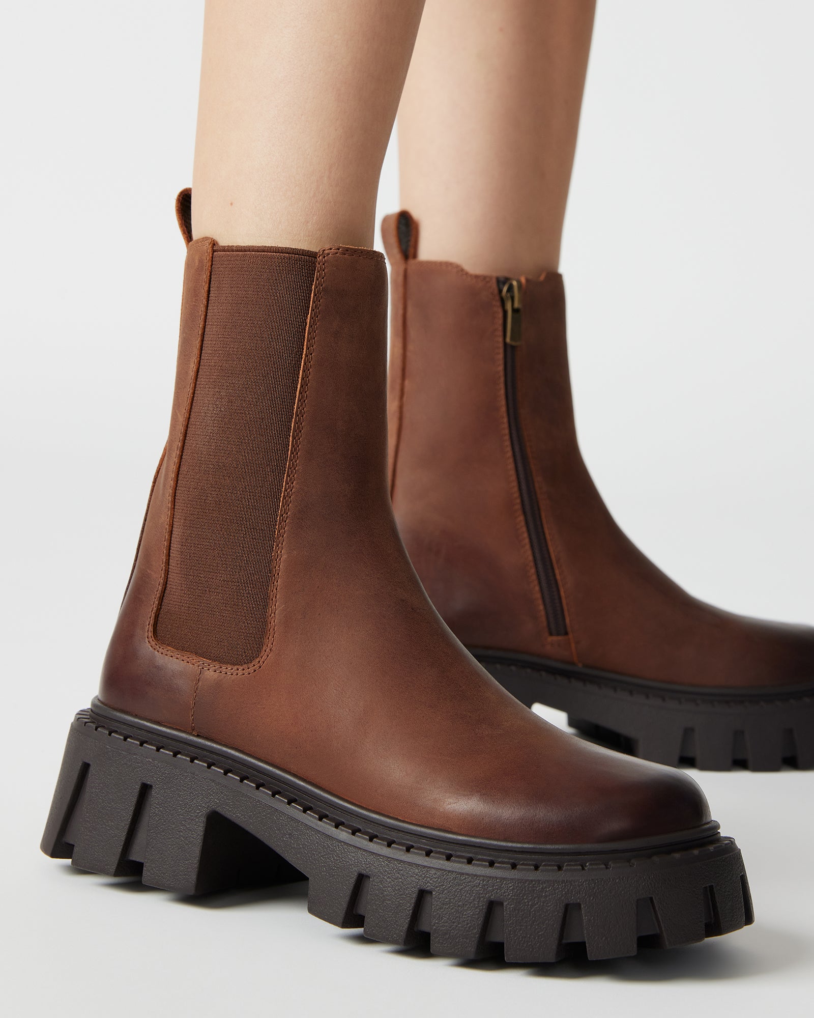 Close-up of elastic gore and side zipper on Chelsea shoes boots
