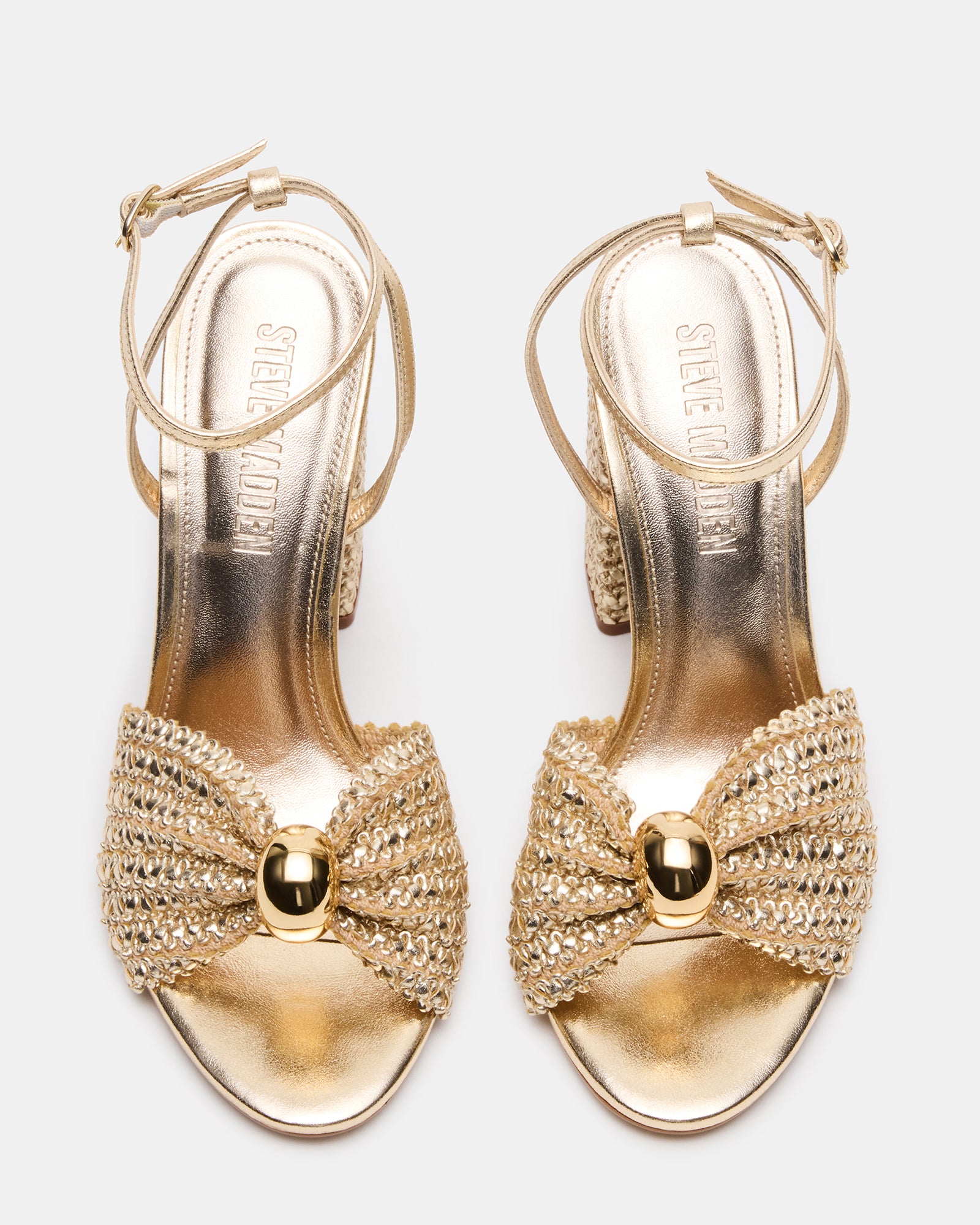 Cheyla gold sandals paired with flowy summer dress during rooftop brunch