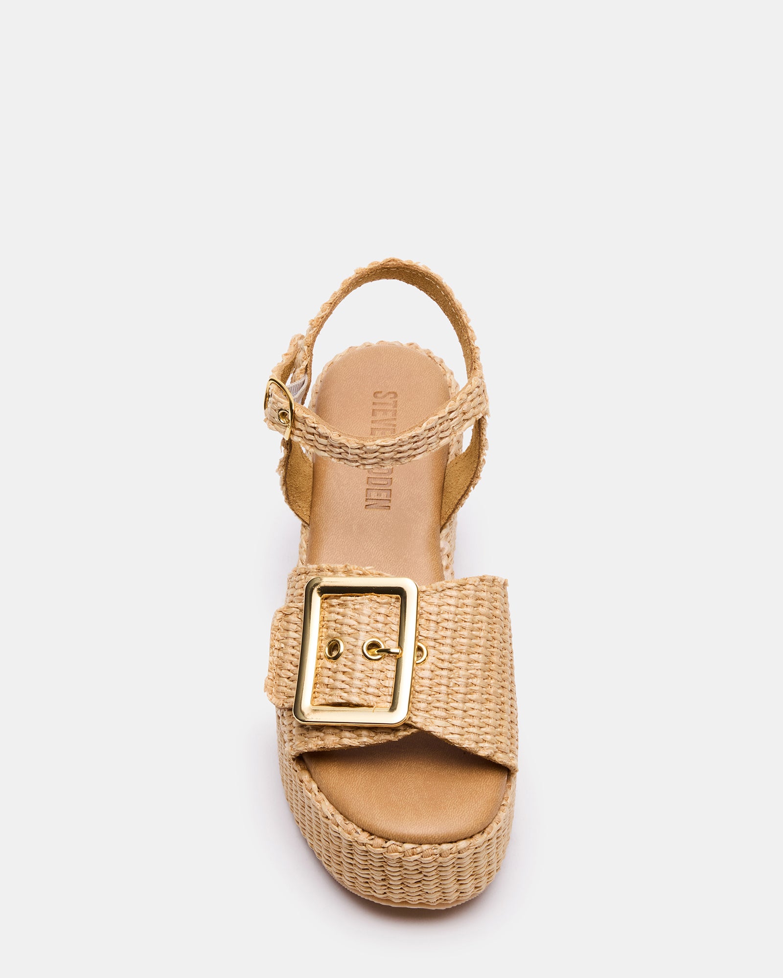 Close-up side view of raffia wedge sandals with buckle strap detail