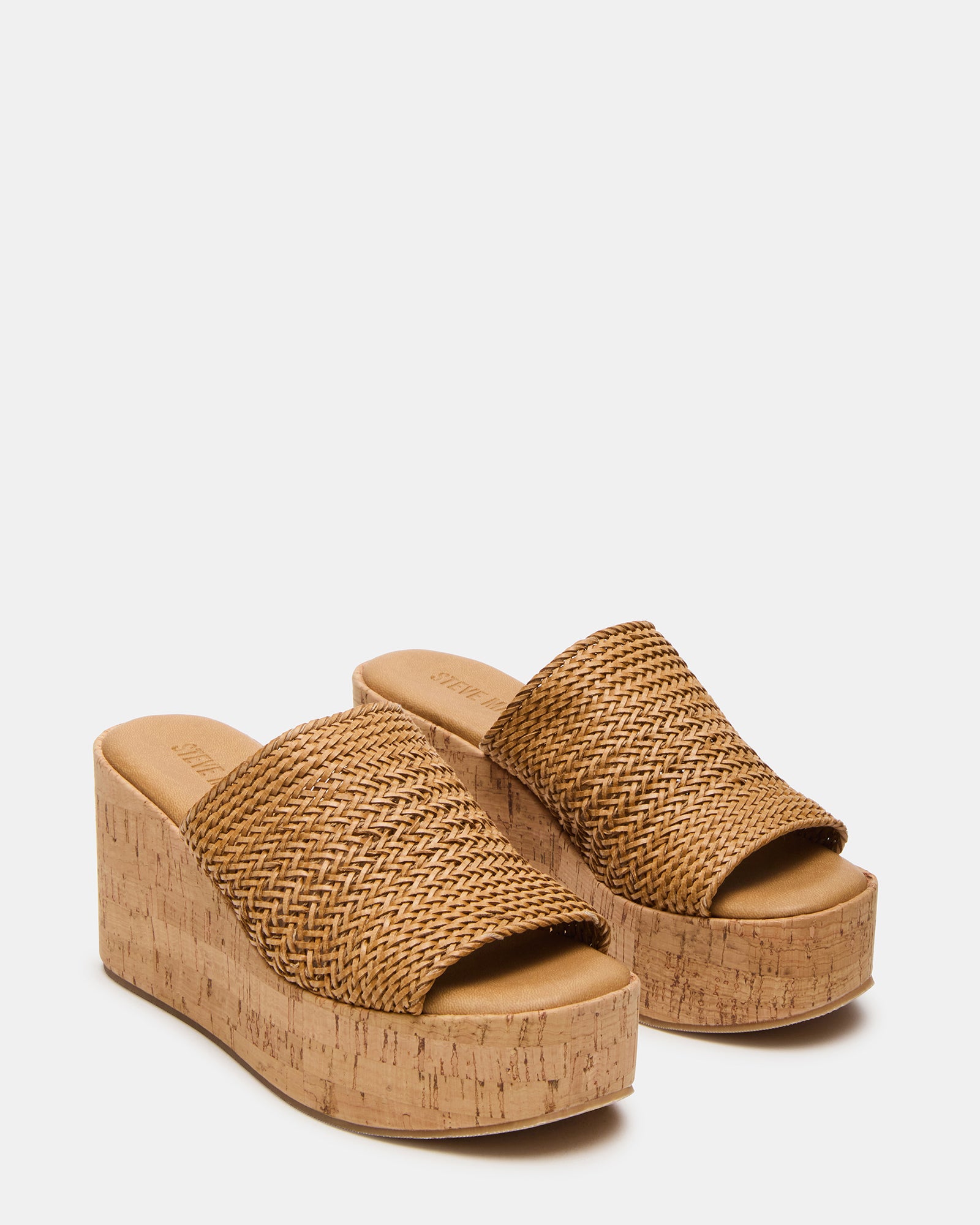 Close-up of raffia platform sandals showcasing their texture