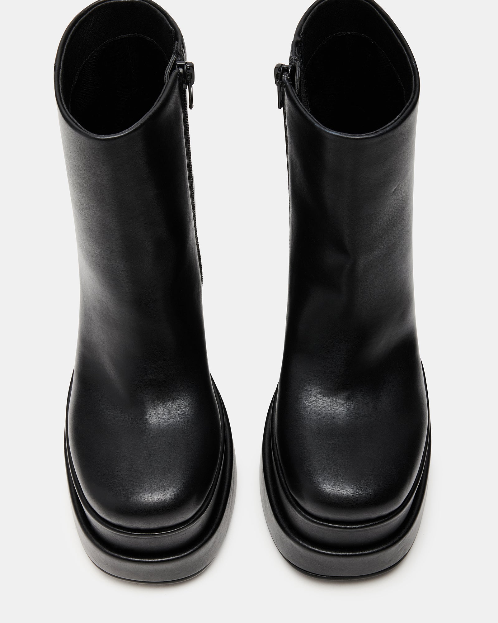 Front angle of Chelsea-style vegan leather boots with a bold 70s vibe