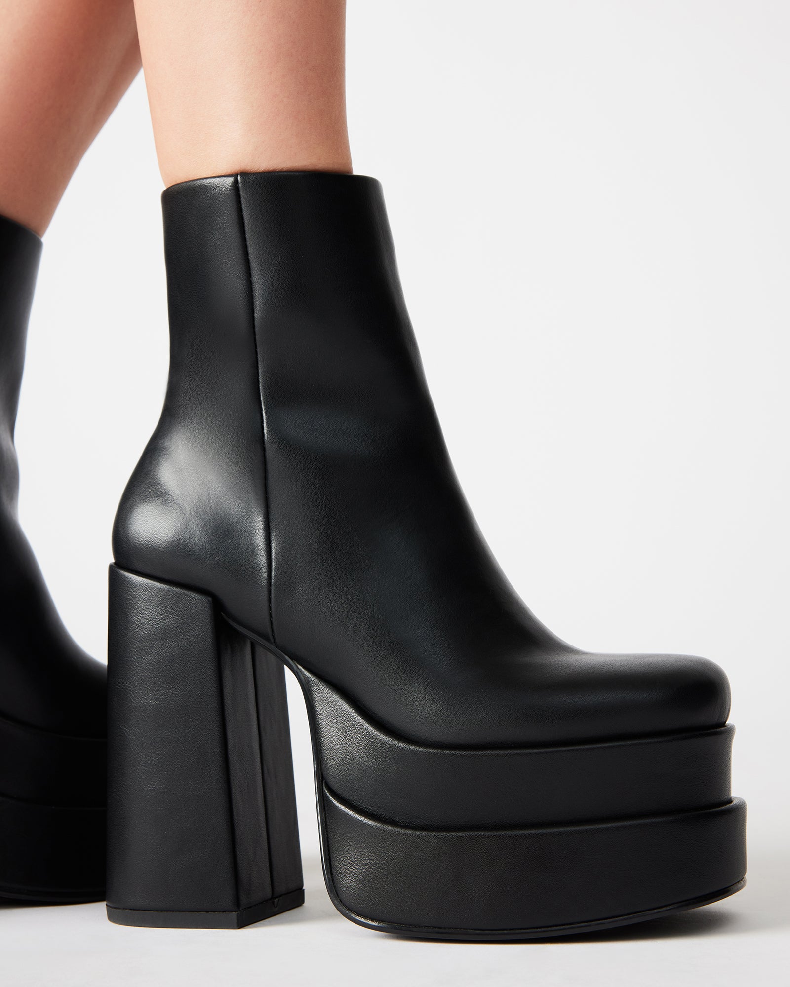 Front angle of Chelsea-style vegan leather boots with a bold 70s vibe