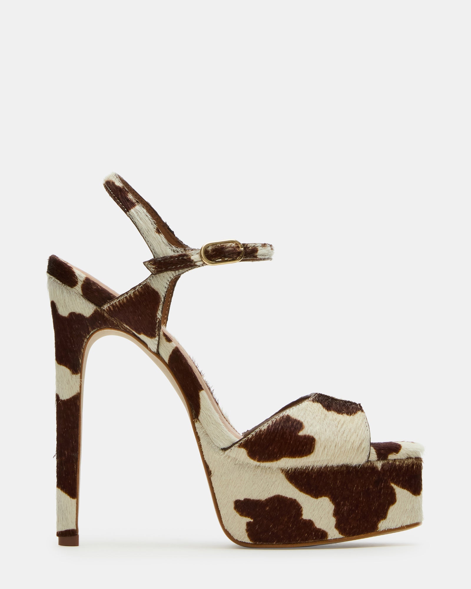 Side view of cow print stiletto heels with leather upper and high heel design