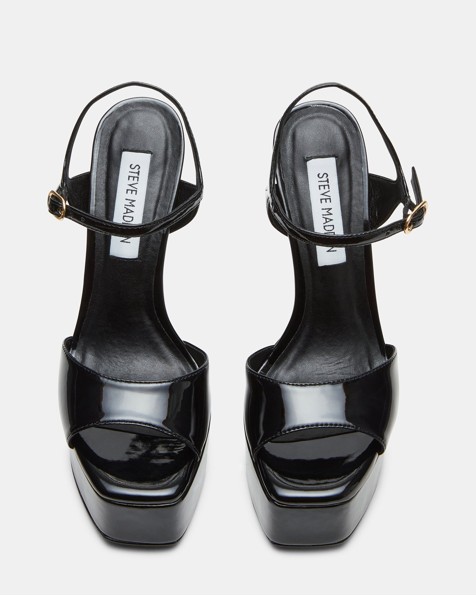 Side view showcasing square toe and bold arch design of platform shoes