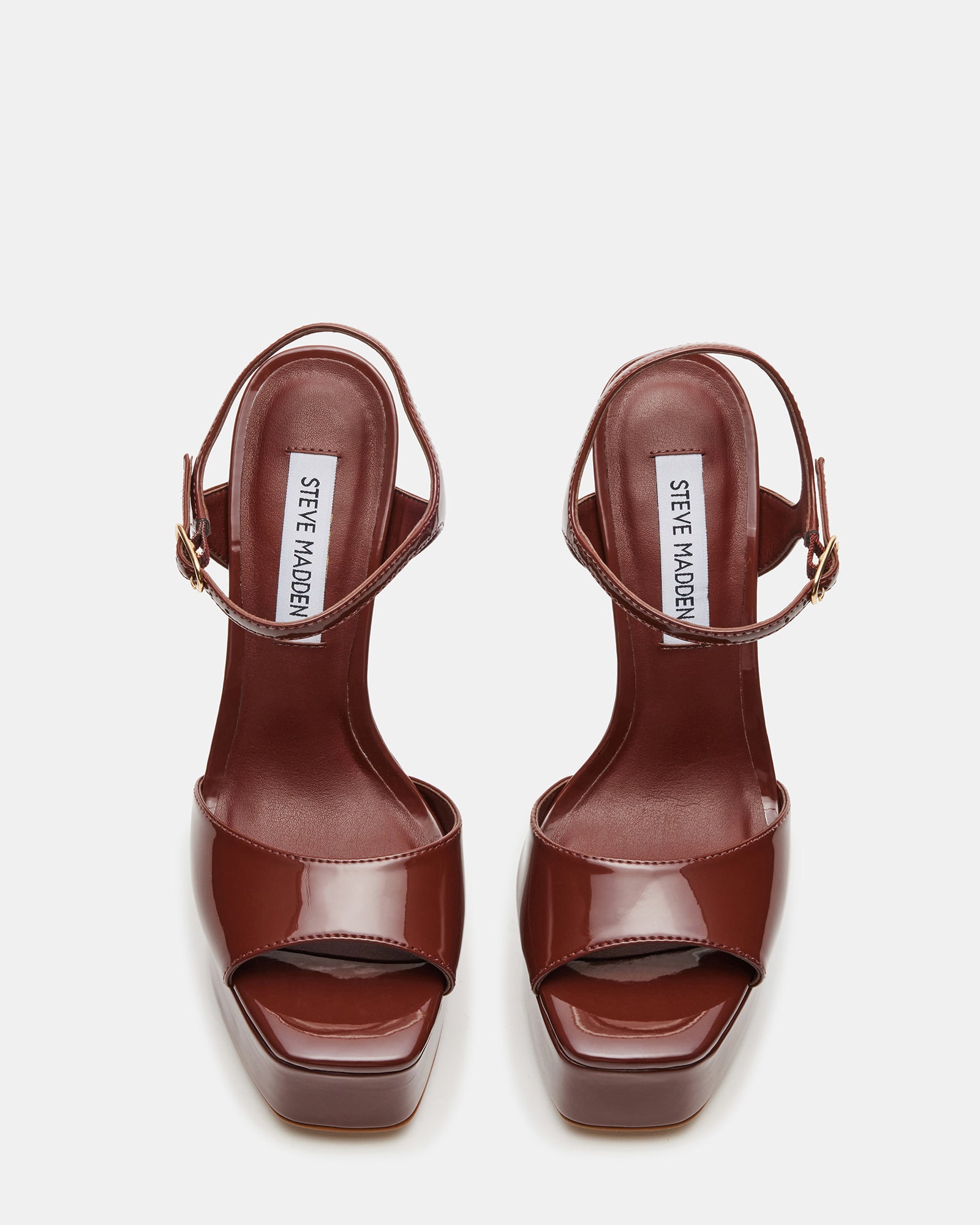 Side view of brown platform stiletto heels with a square toe.
