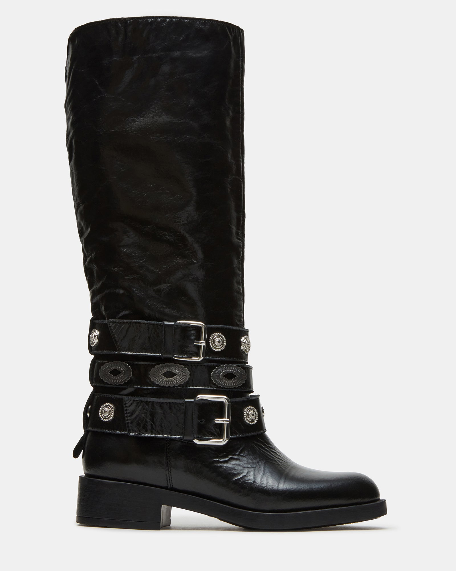 Side view of Steve Madden black leather moto boots showcasing buckle details.