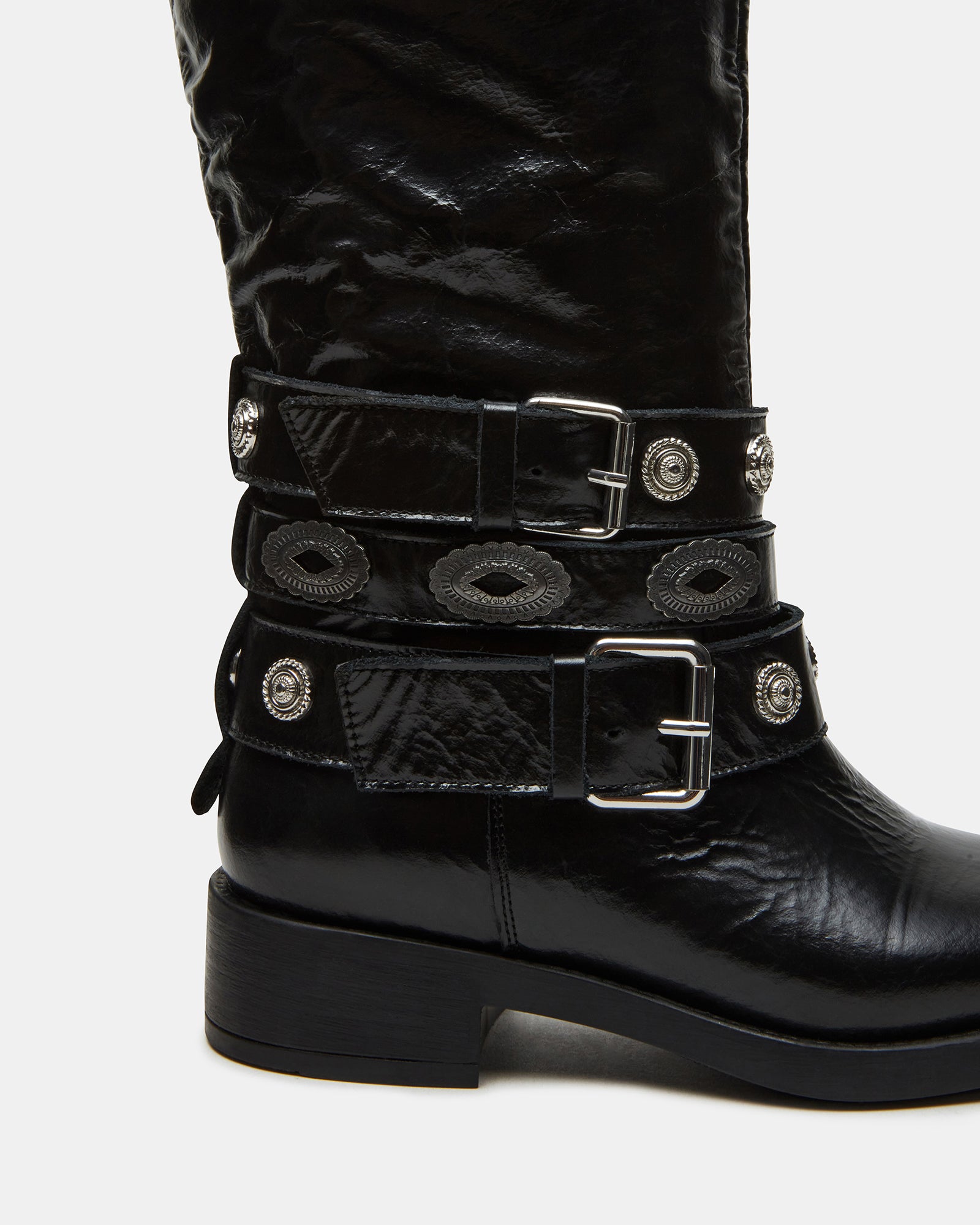 Steve Madden leather motorcycle boots worn with casual attire.