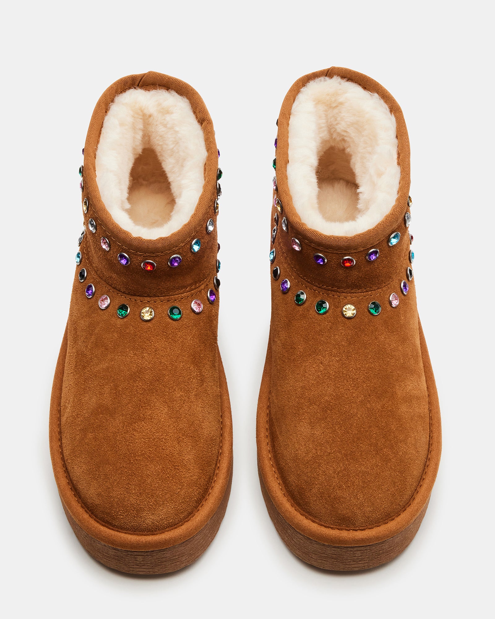 Close-up of rhinestone booties showing suede texture and embellishments