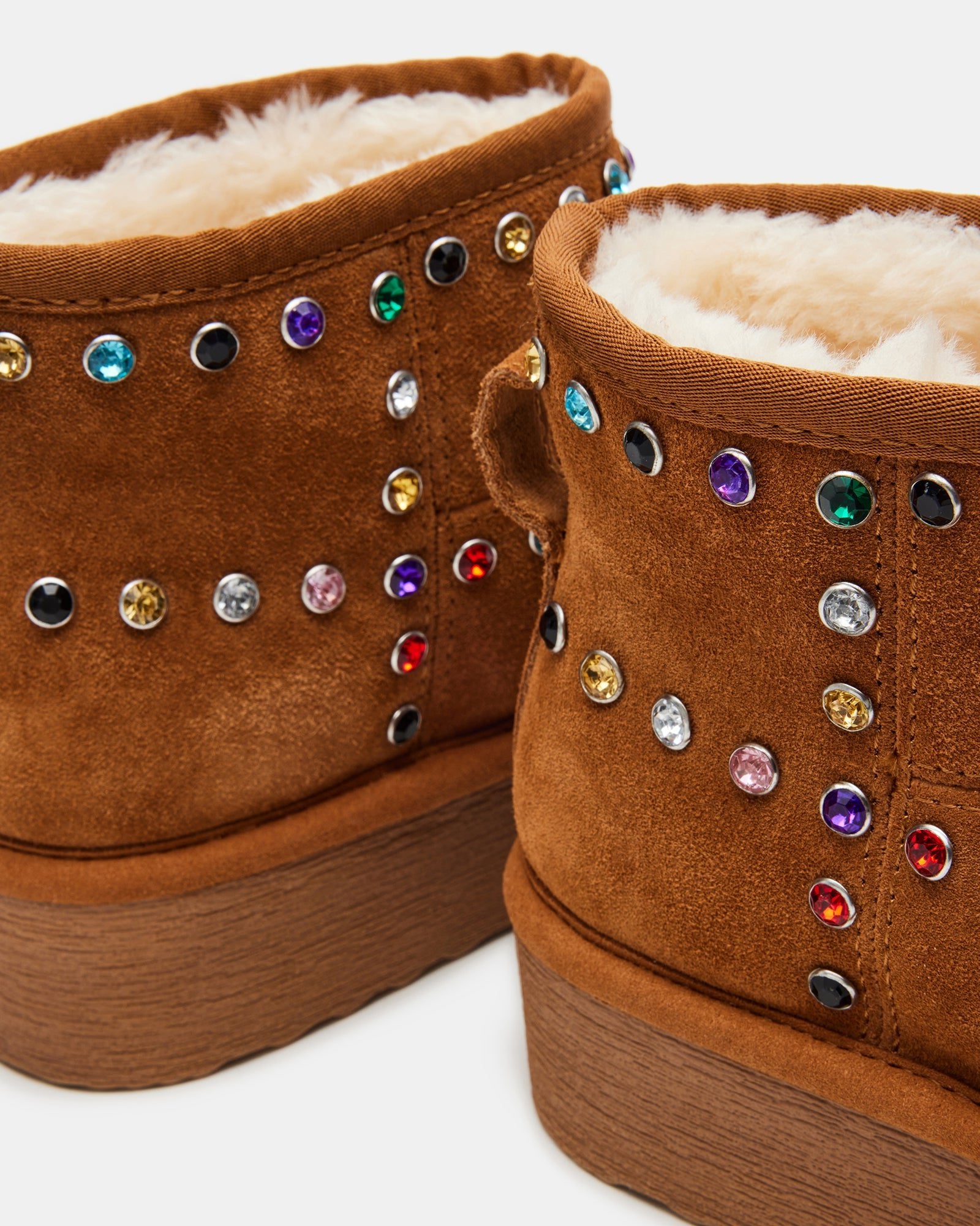 Brown platform boots with faux fur lining, styled with jeans