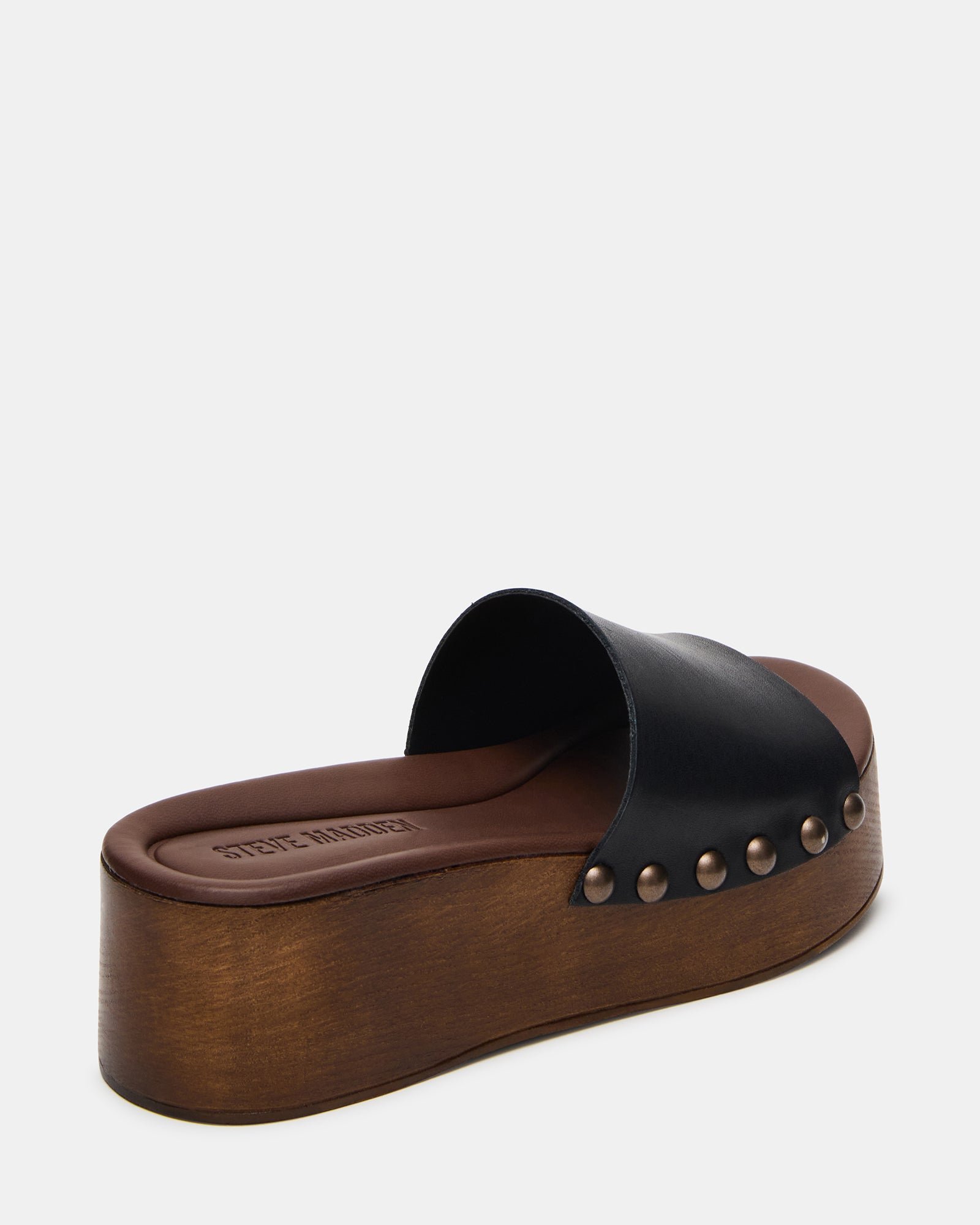 Lifestyle image featuring sandals for women with platform design, styled on city street
