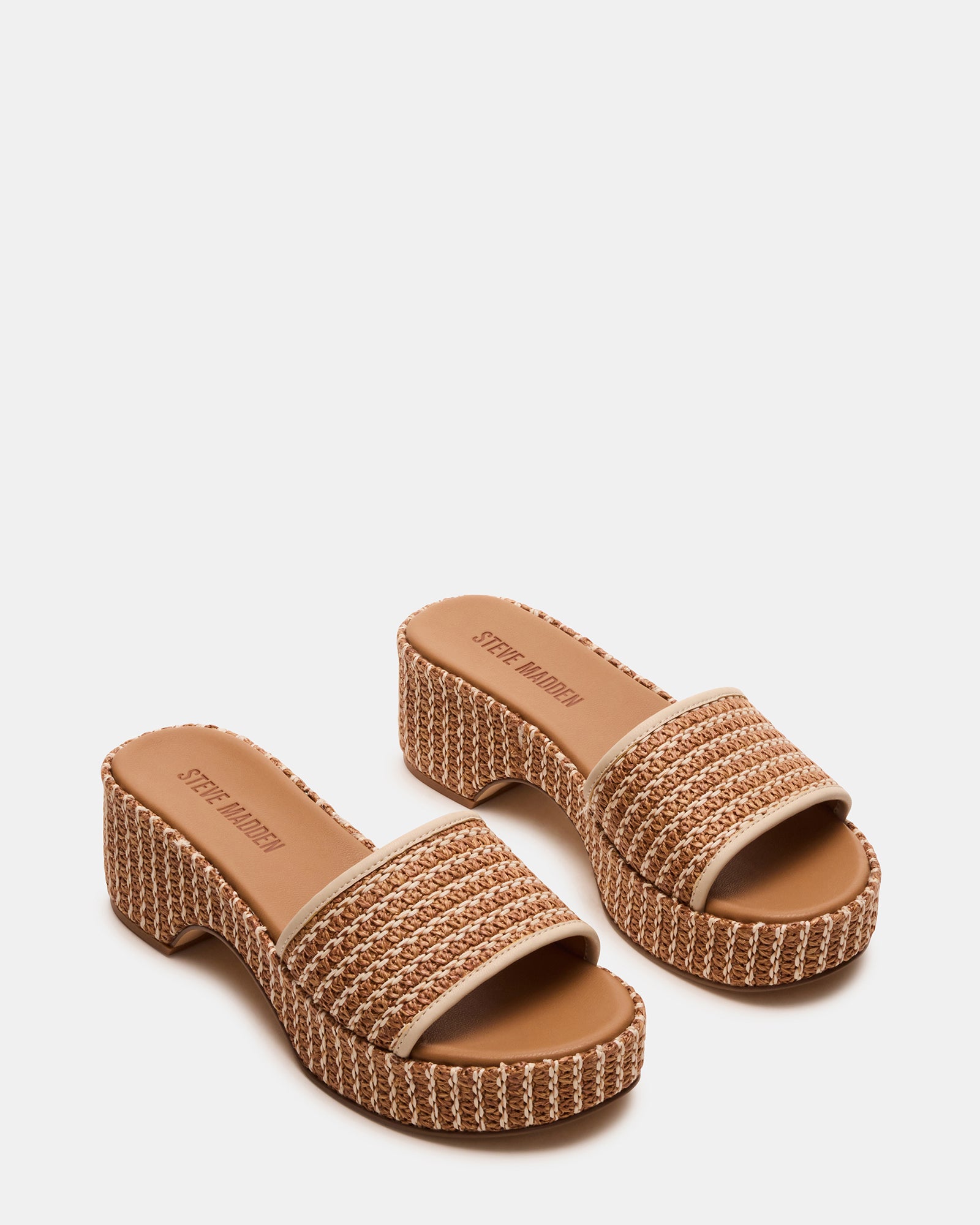 Close-up of raffia weave and platform sole on black platform sandals