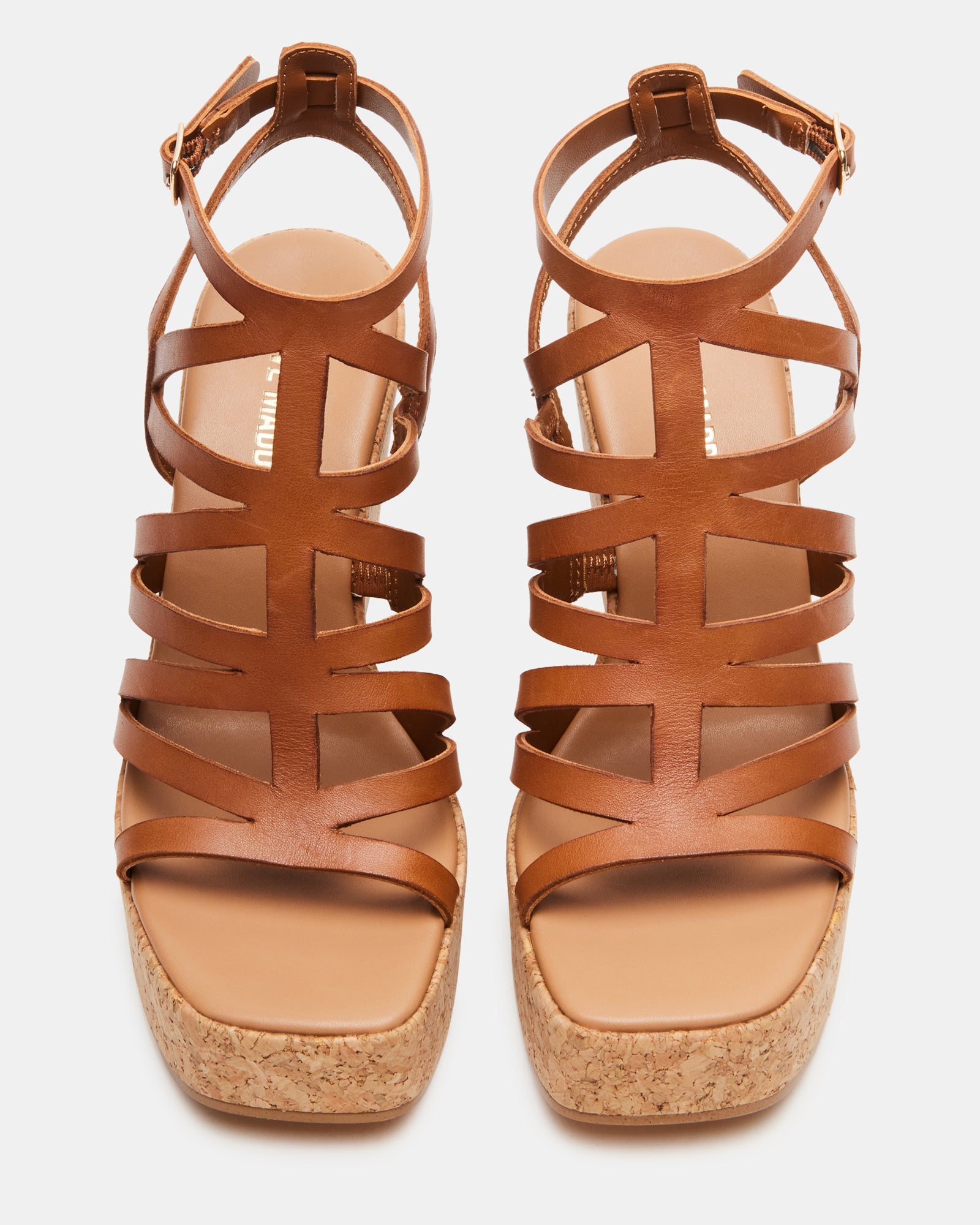 Close-up of Cozette tan leather platform wedge sandals showing square toe design.