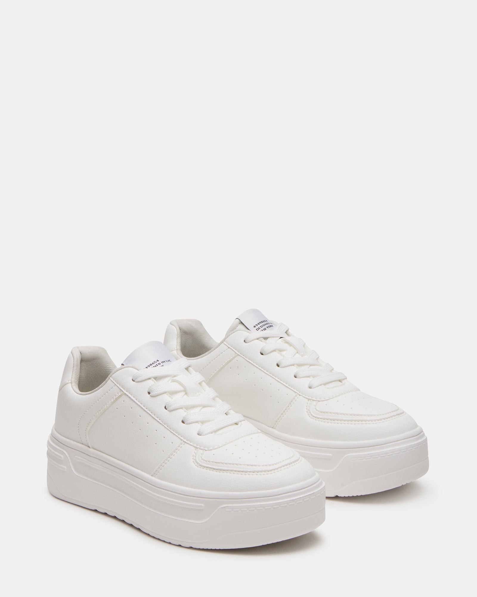 Close-up of vegan leather stitching detail on mens white sneakers