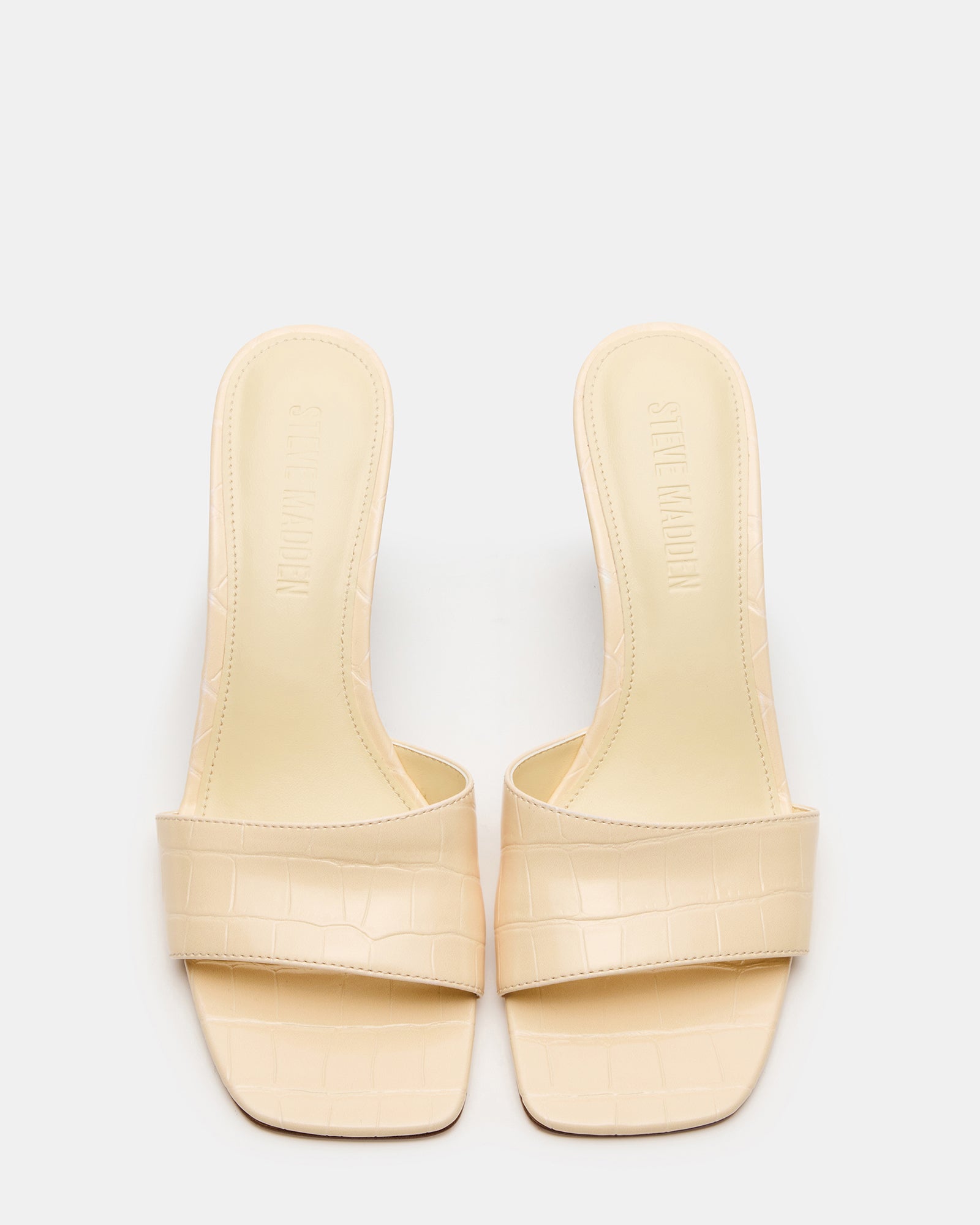 Stylish white wedge sandals with crocodile texture, perfect for summer outfits.