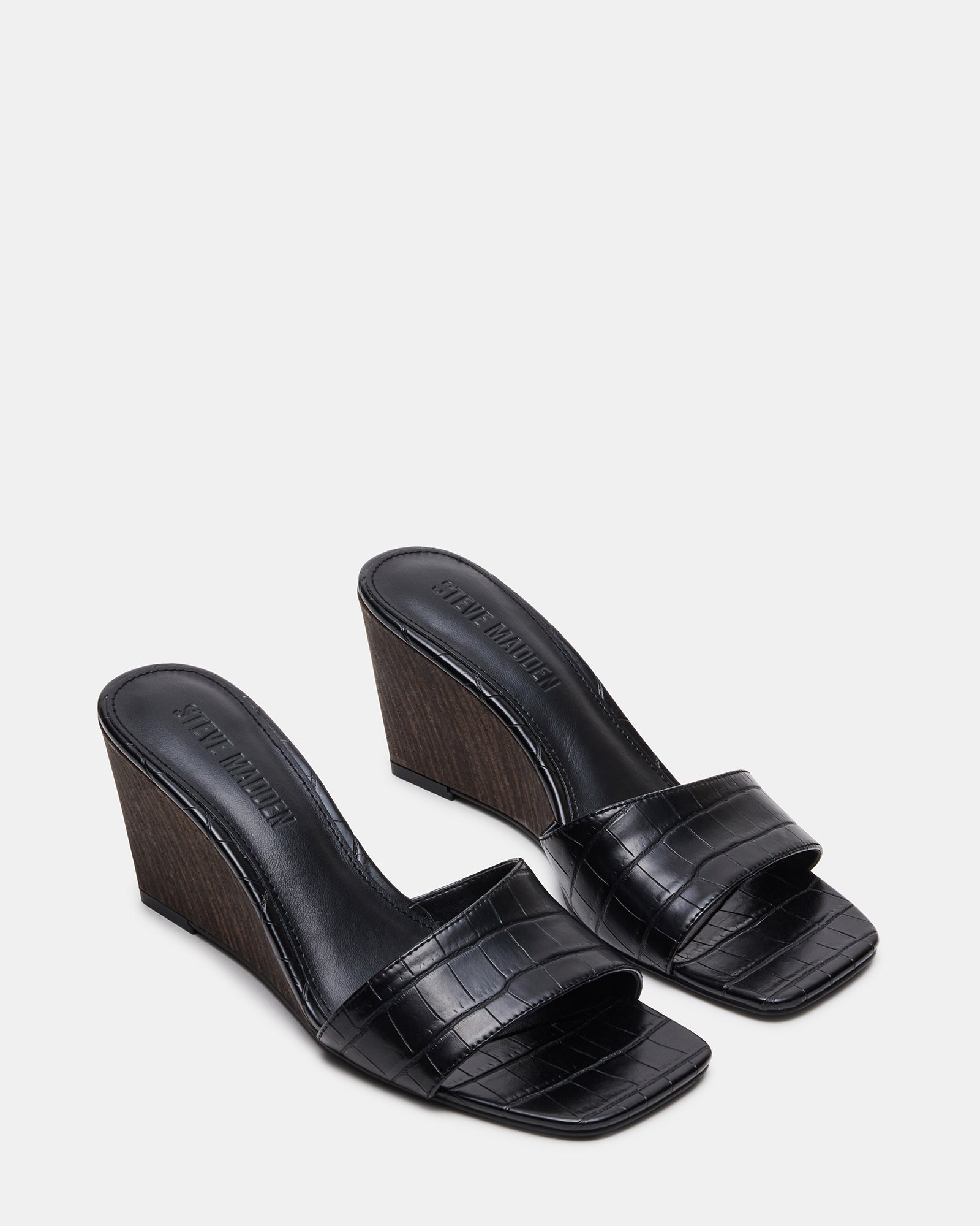 Side view of vegan sandals showcasing the wedge heel design.