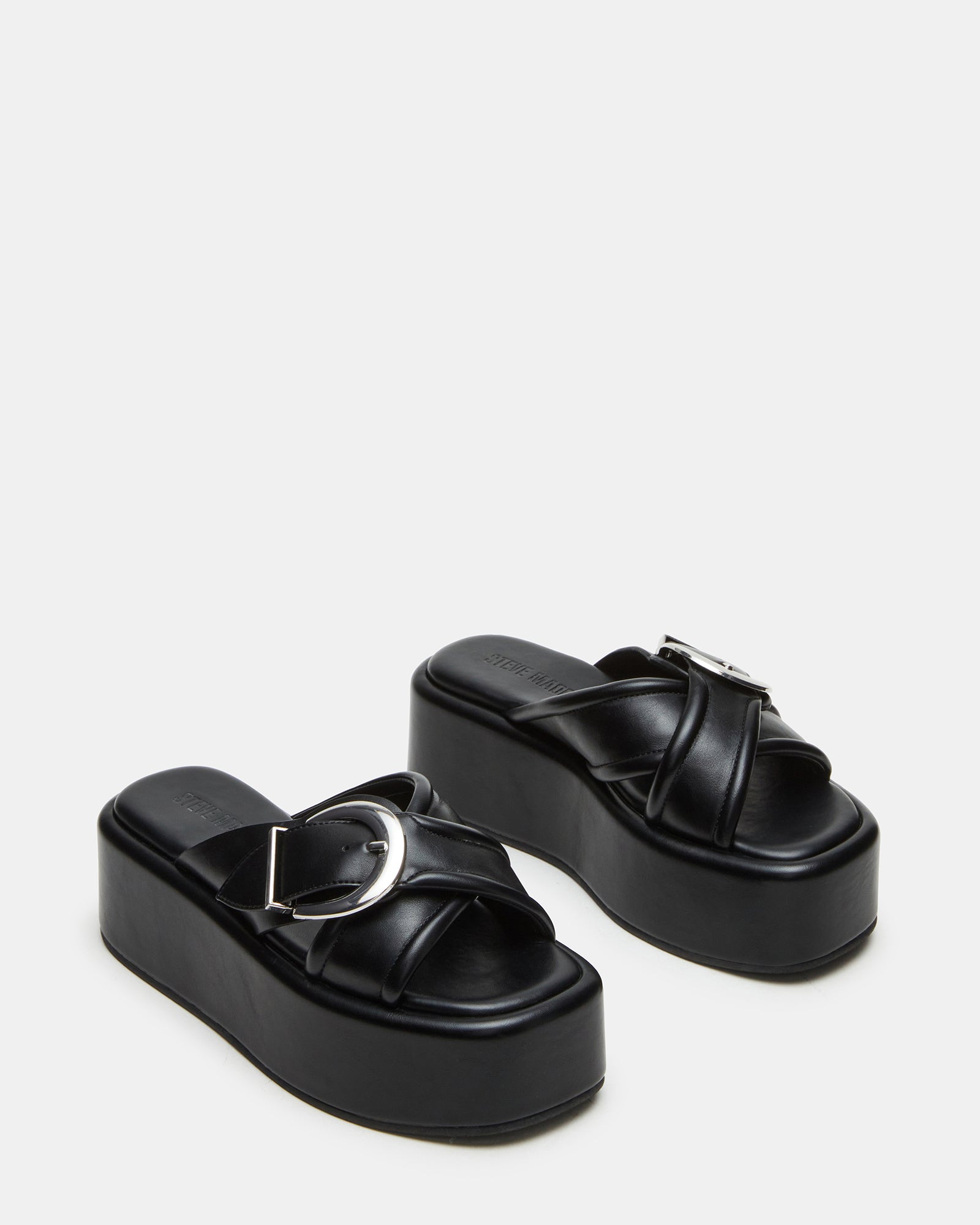 Side angle showcasing the 2.25-inch heel and crisscross buckle detail