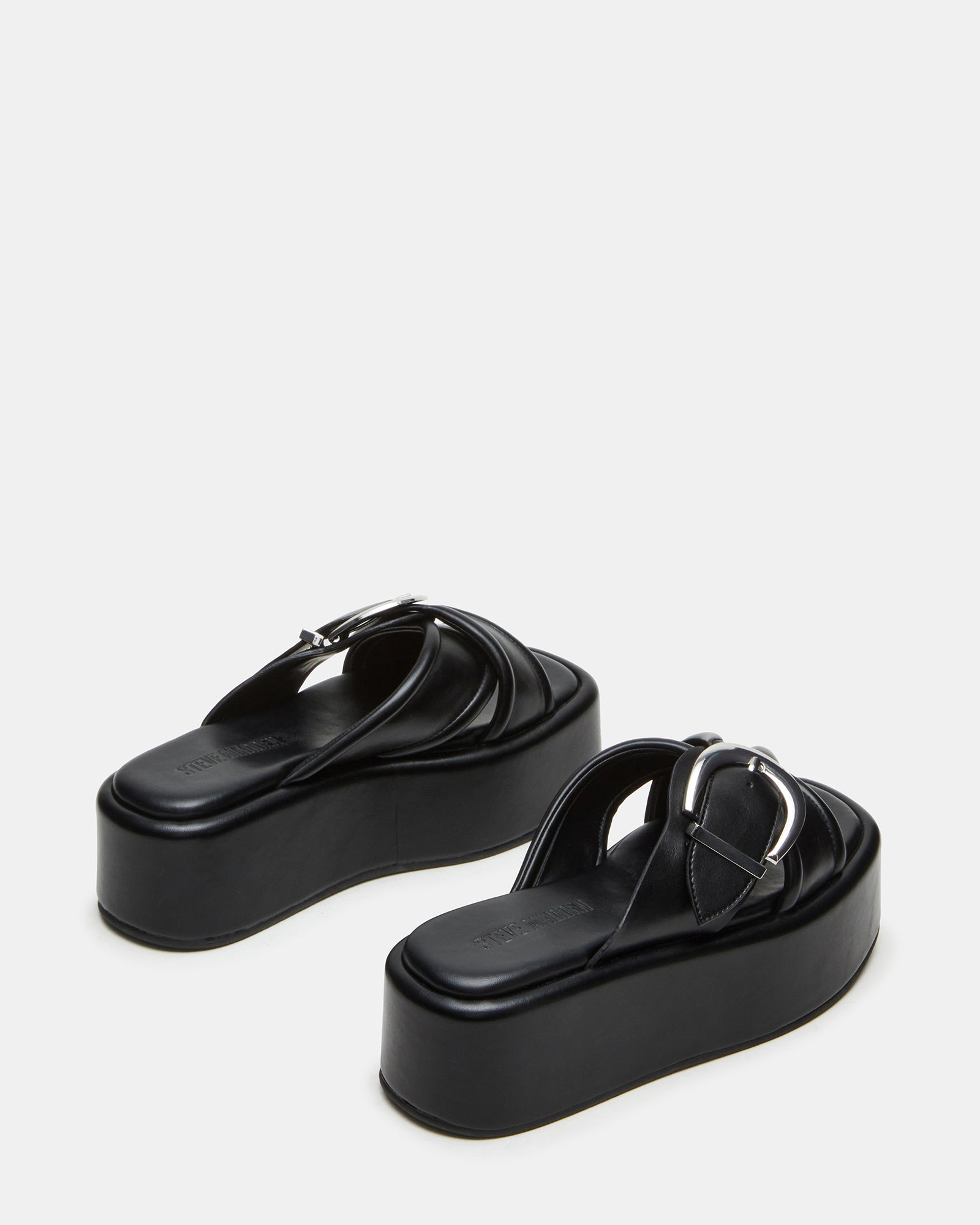 Side angle showcasing the 2.25-inch heel and crisscross buckle detail