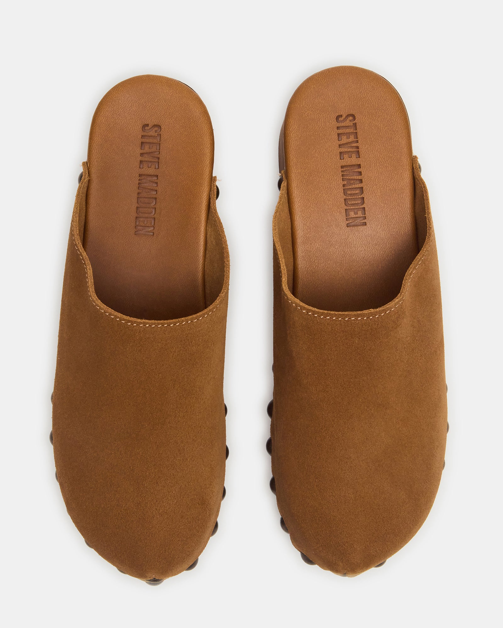 Close-up of Danver chestnut suede mule clogs showing studded details.